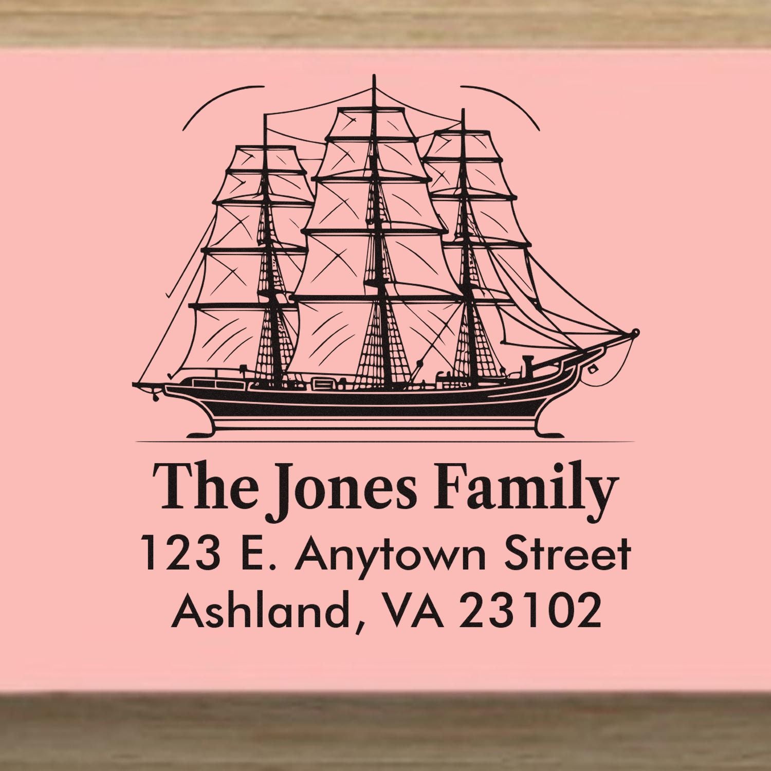 Custom return address rubber stamp with sailing ship design for The Jones Family, 123 E. Anytown Street, Ashland, VA 23102.