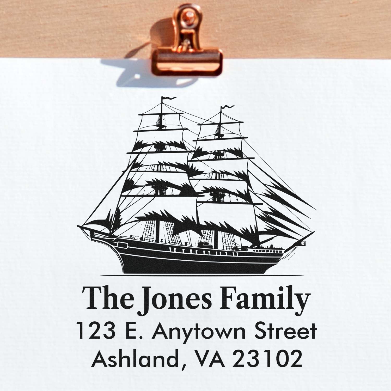Custom rubber return address stamp with tall ship design for The Jones Family, Ashland, VA 23102.