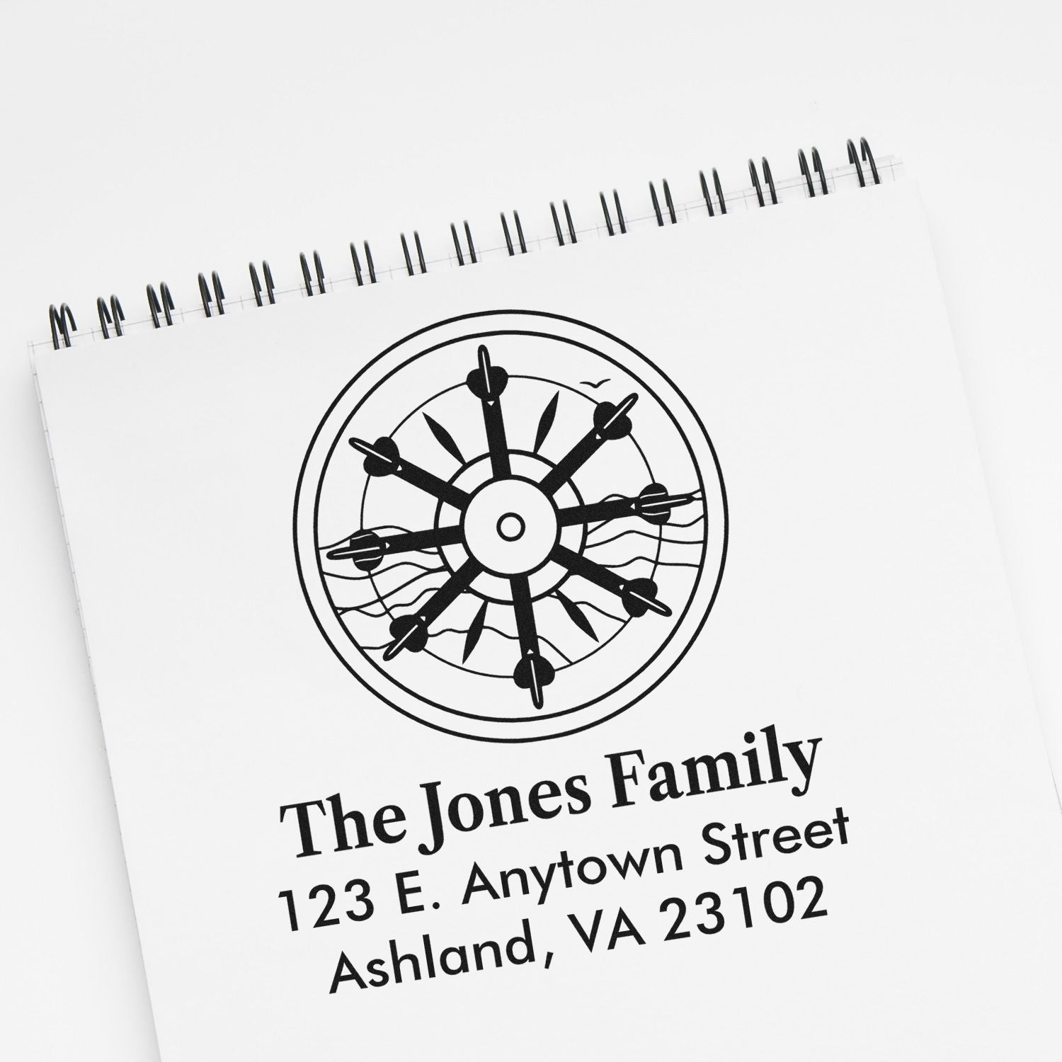 Custom family address rubber stamp with nautical wheel design for The Jones Family, Ashland, VA 23102.