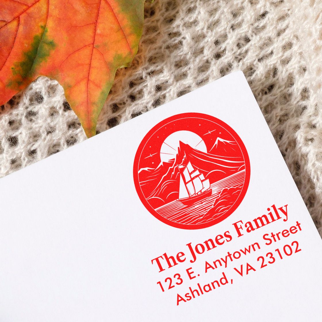 Custom return address rubber stamp with sailboat logo for The Jones Family, 123 E. Anytown Street, Ashland, VA 23102.