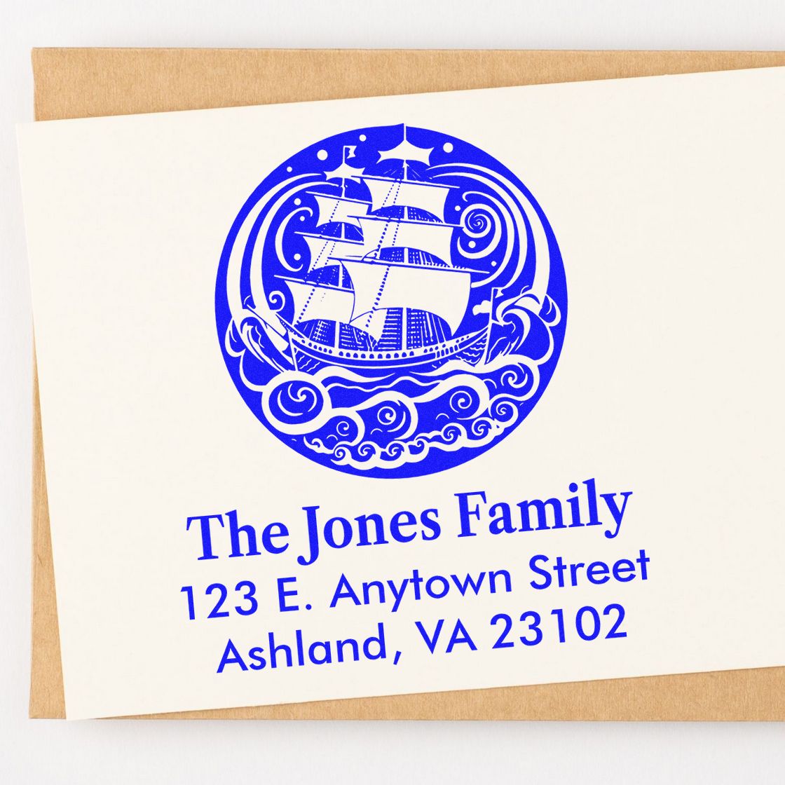 Custom blue family address rubber stamp with ship design for The Jones Family, 123 E. Anytown Street, Ashland, VA 23102.