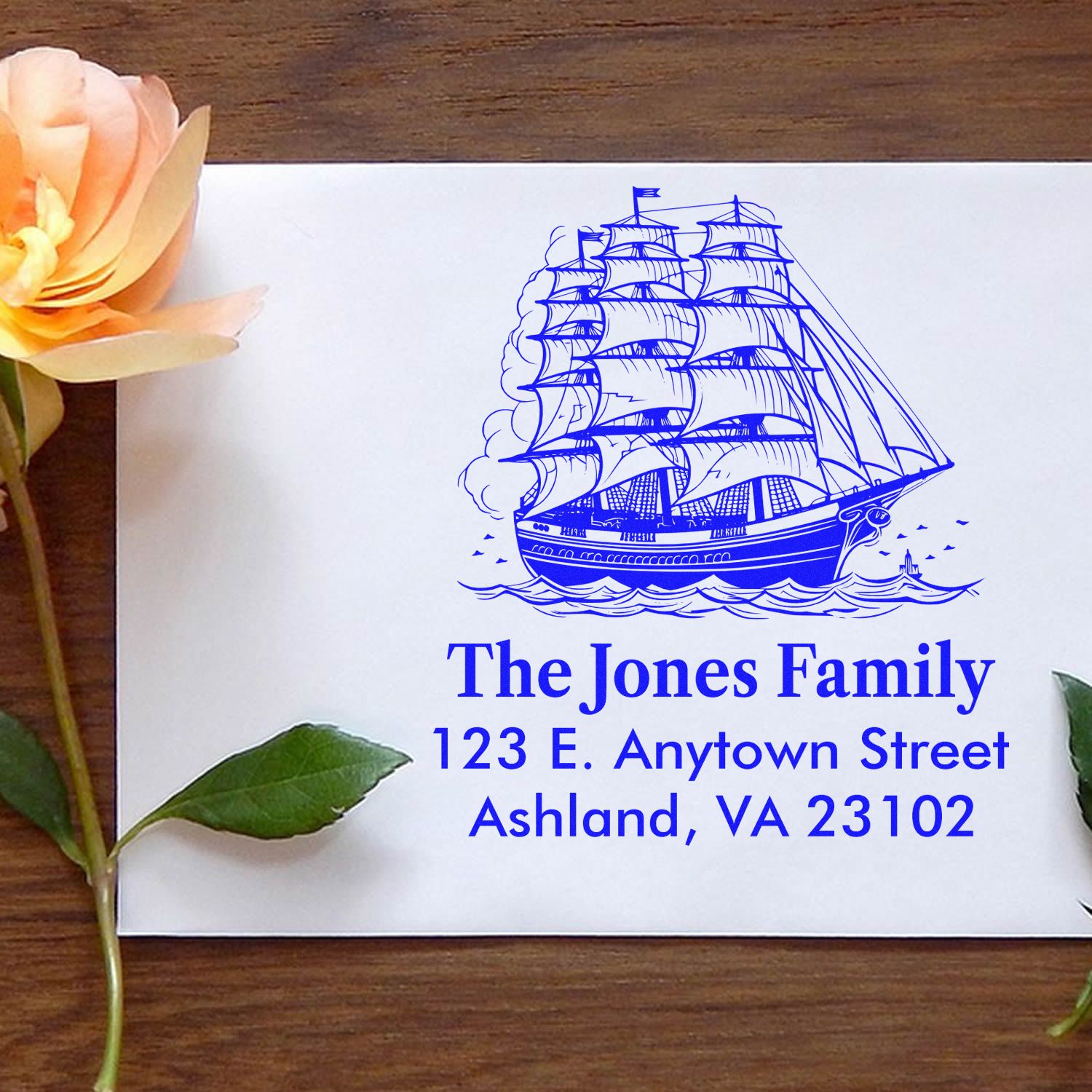 Custom rubber stamp with sailing ship design and family return address for personalized mail in Ashland, VA.