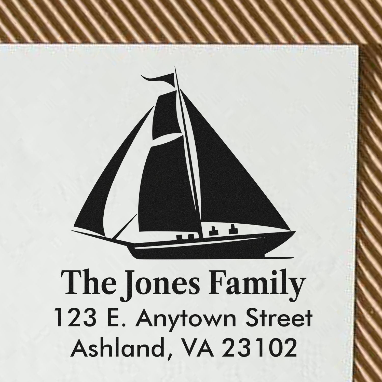 Custom sailboat return address rubber stamp for The Jones Family, personalized with name and Ashland, VA address.