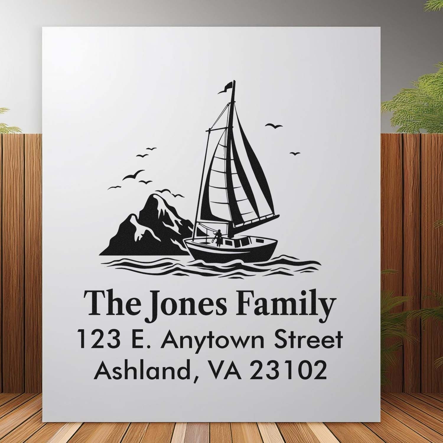Custom nautical return address rubber stamp with sailboat design, family name, and address for personalized mail.