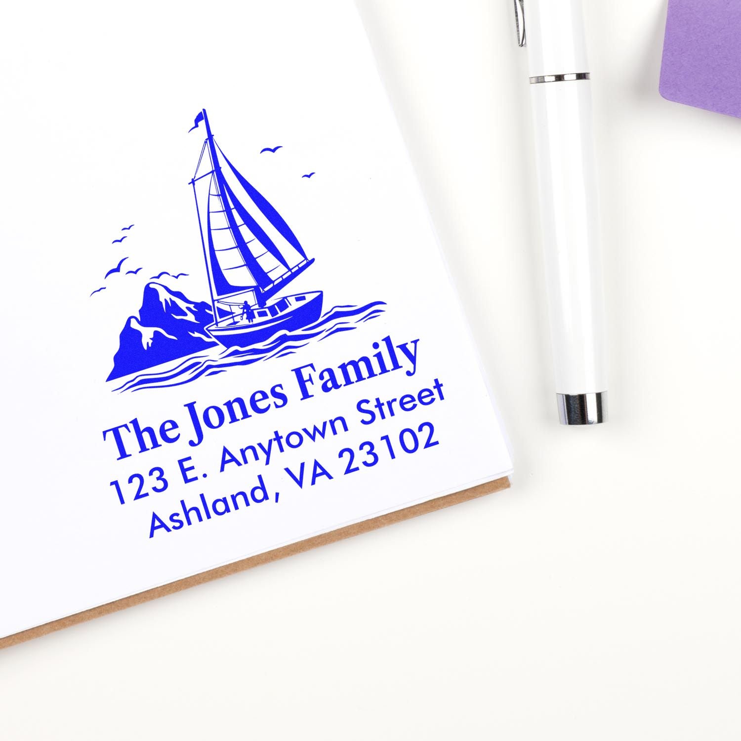 Custom nautical return address rubber stamp with sailboat design for The Jones Family, personalized home address stamp.