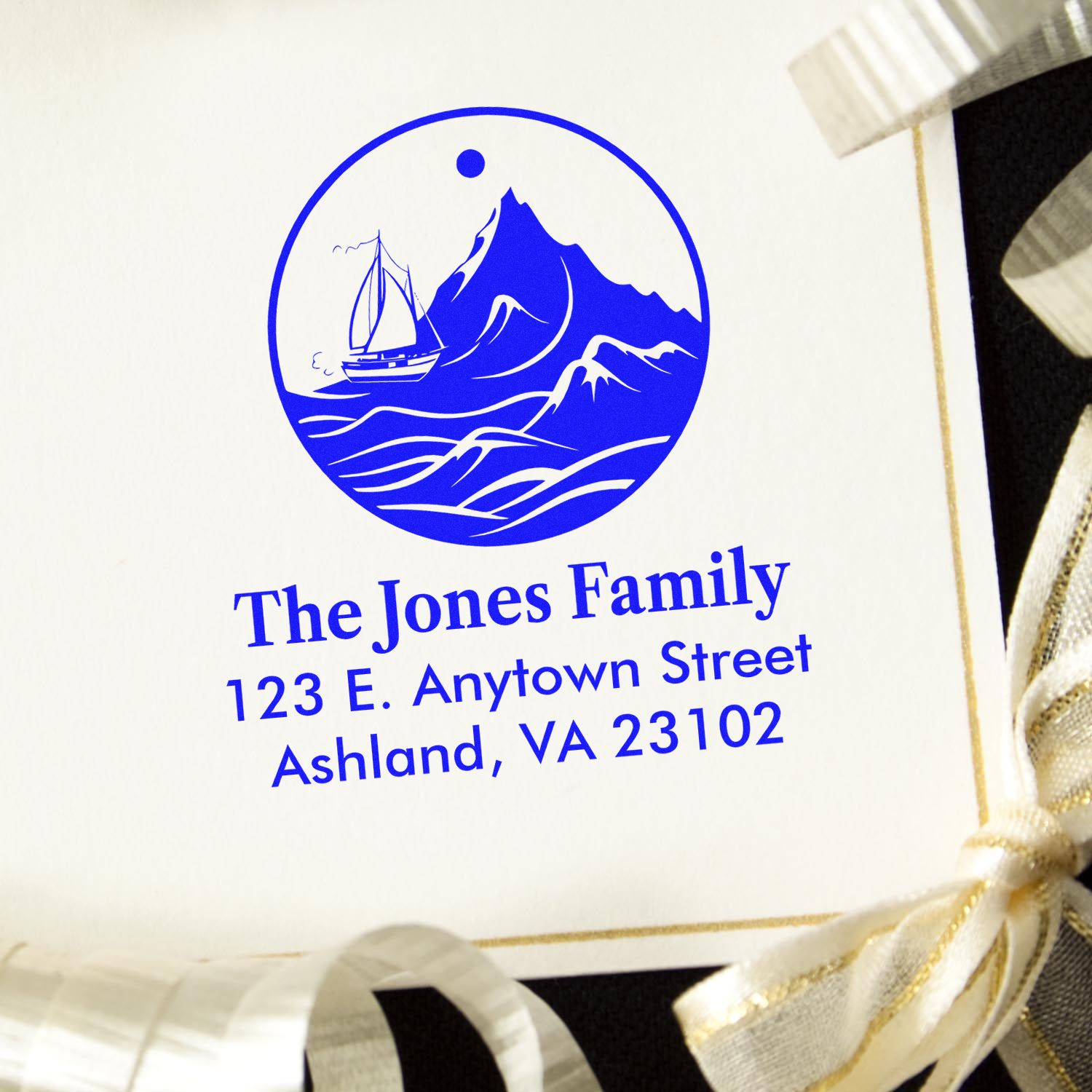 Personalized family return address rubber stamp with mountain and sailboat logo for custom envelopes and wedding invitations.