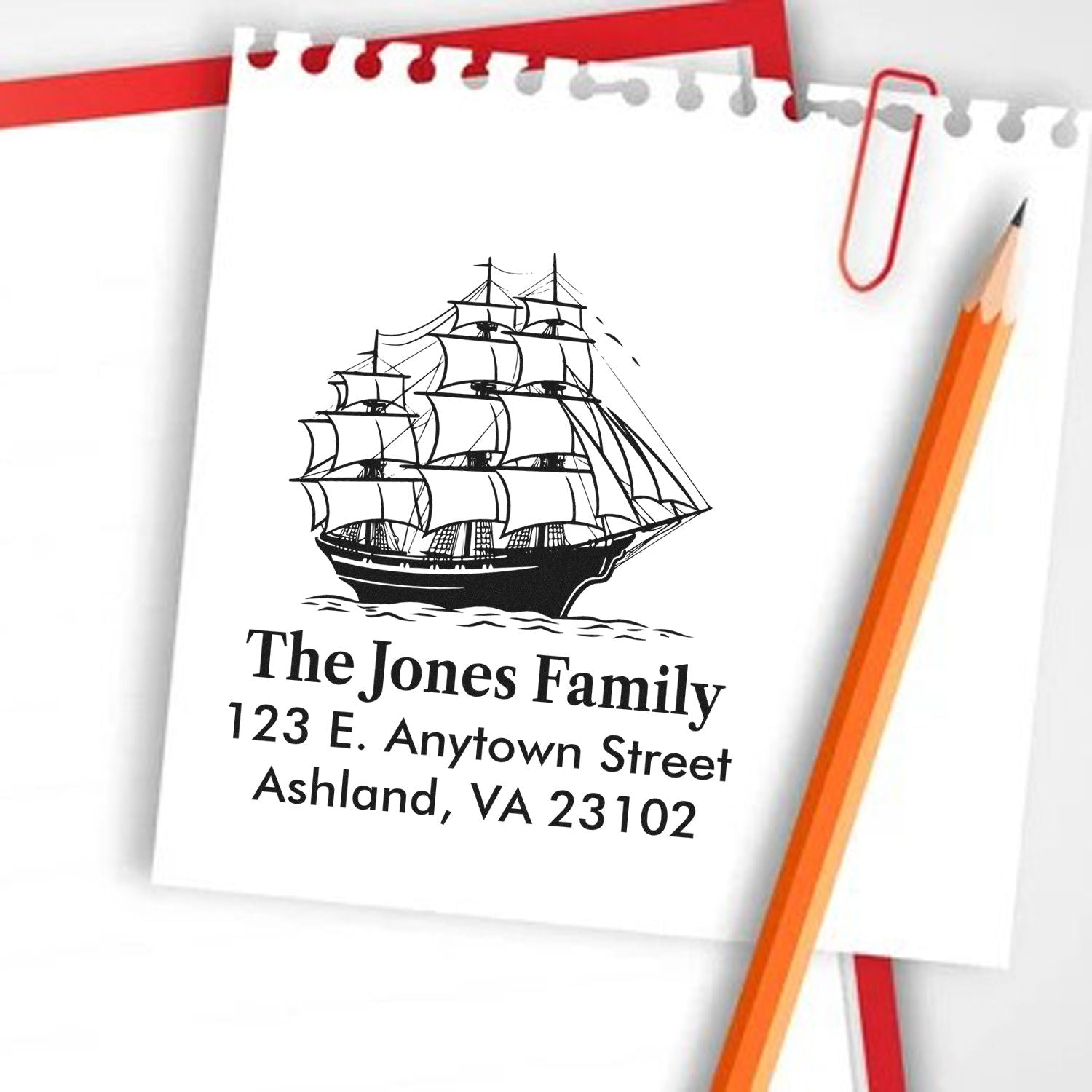 Custom family address rubber stamp with sailing ship design for personalized mail, featuring name and street address.