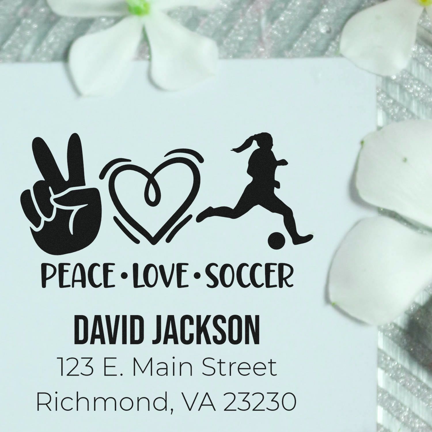 Personalized rubber stamp for David Jackson, featuring peace love soccer and return address in Richmond, VA.