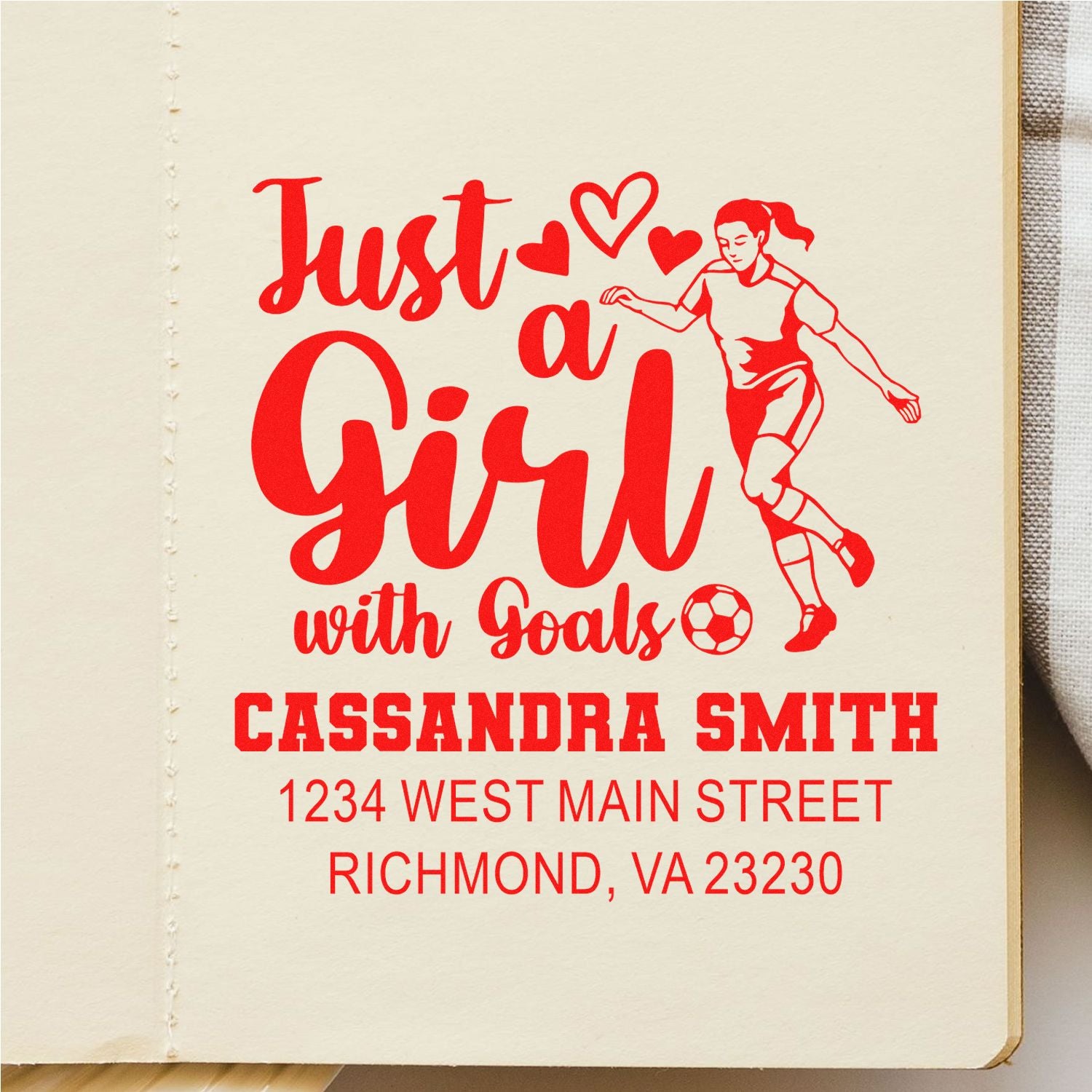 Personalized rubber stamp for a soccer player, reading Just a Girl with Goals with name and address.