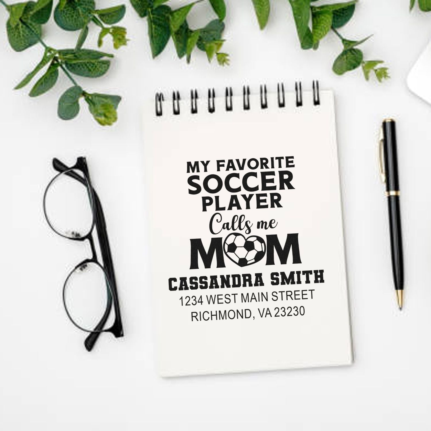 Personalized soccer mom rubber stamp mockup on notebook, with custom name and address for a sporty gift.