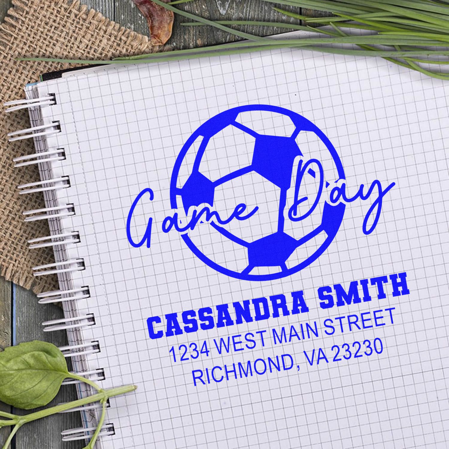 Custom soccer game day rubber stamp design with Cassandra Smith name and address on notebook mockup.