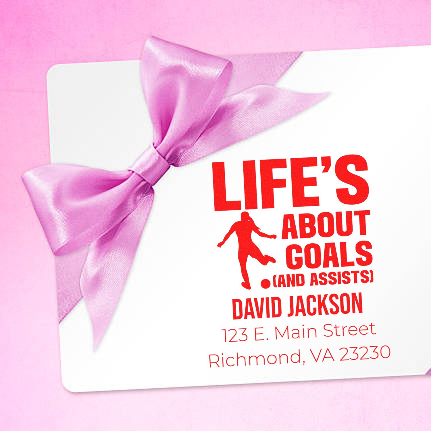 Custom soccer rubber stamp design with pink bow, personalized name and address, and Lifes About Goals slogan.