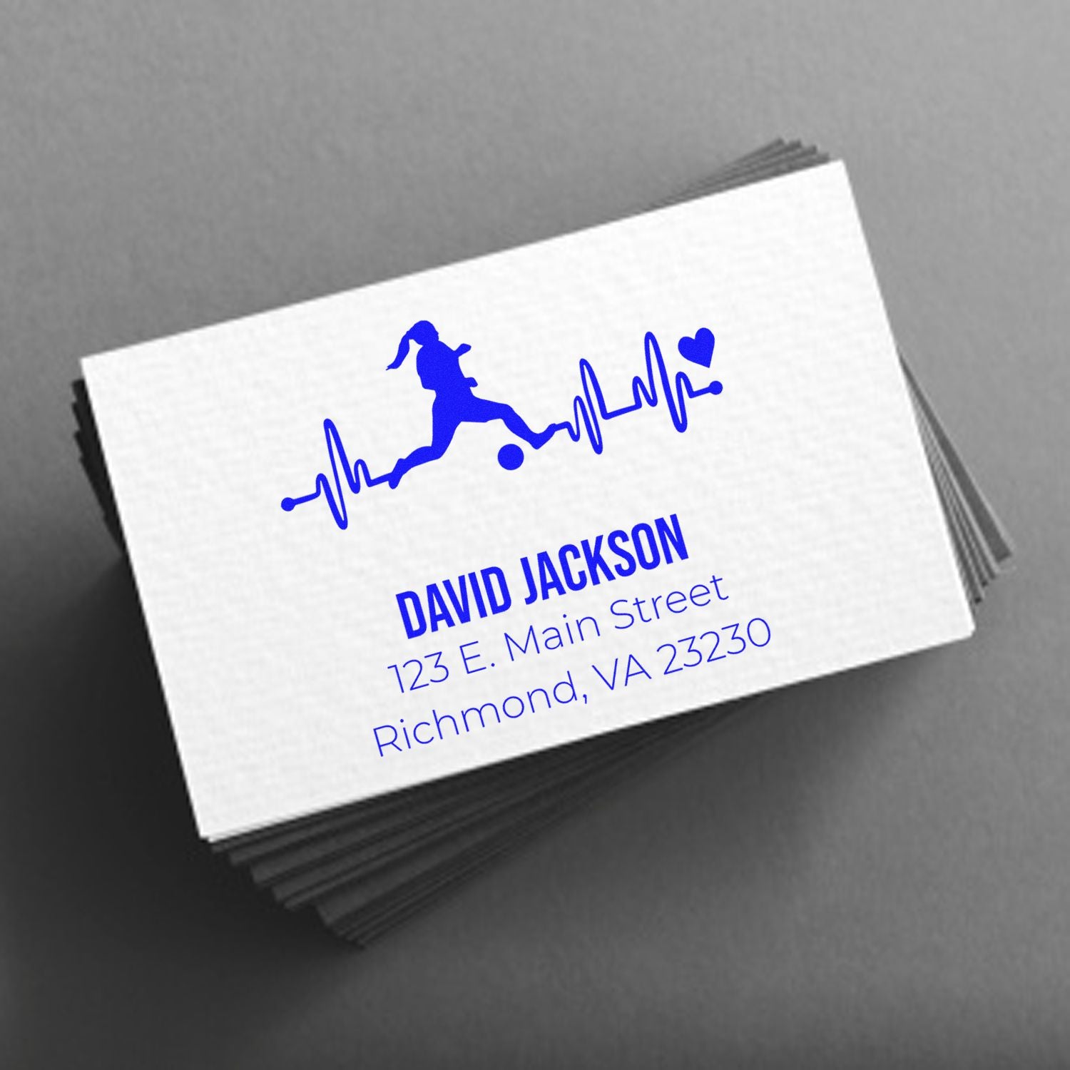 Custom rubber stamp for fitness business cards with runner heartbeat logo, name, and address.