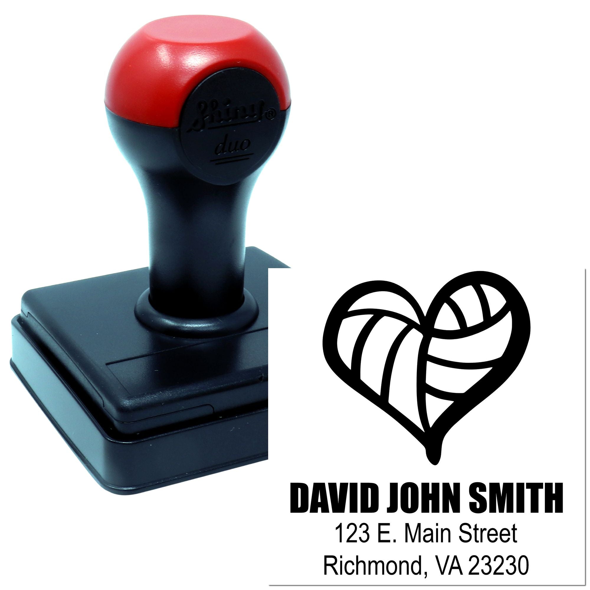 Custom self-inking rubber stamp with heart logo and address imprint for business branding and return address use.