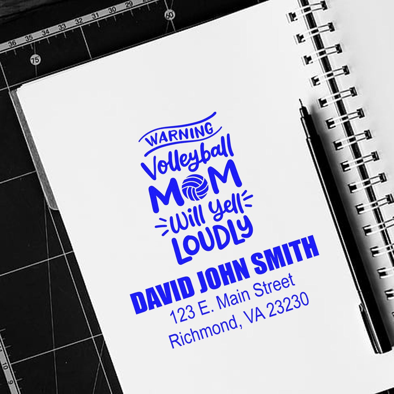 Custom volleyball mom rubber stamp design with warning slogan and personalized name and address in blue ink.