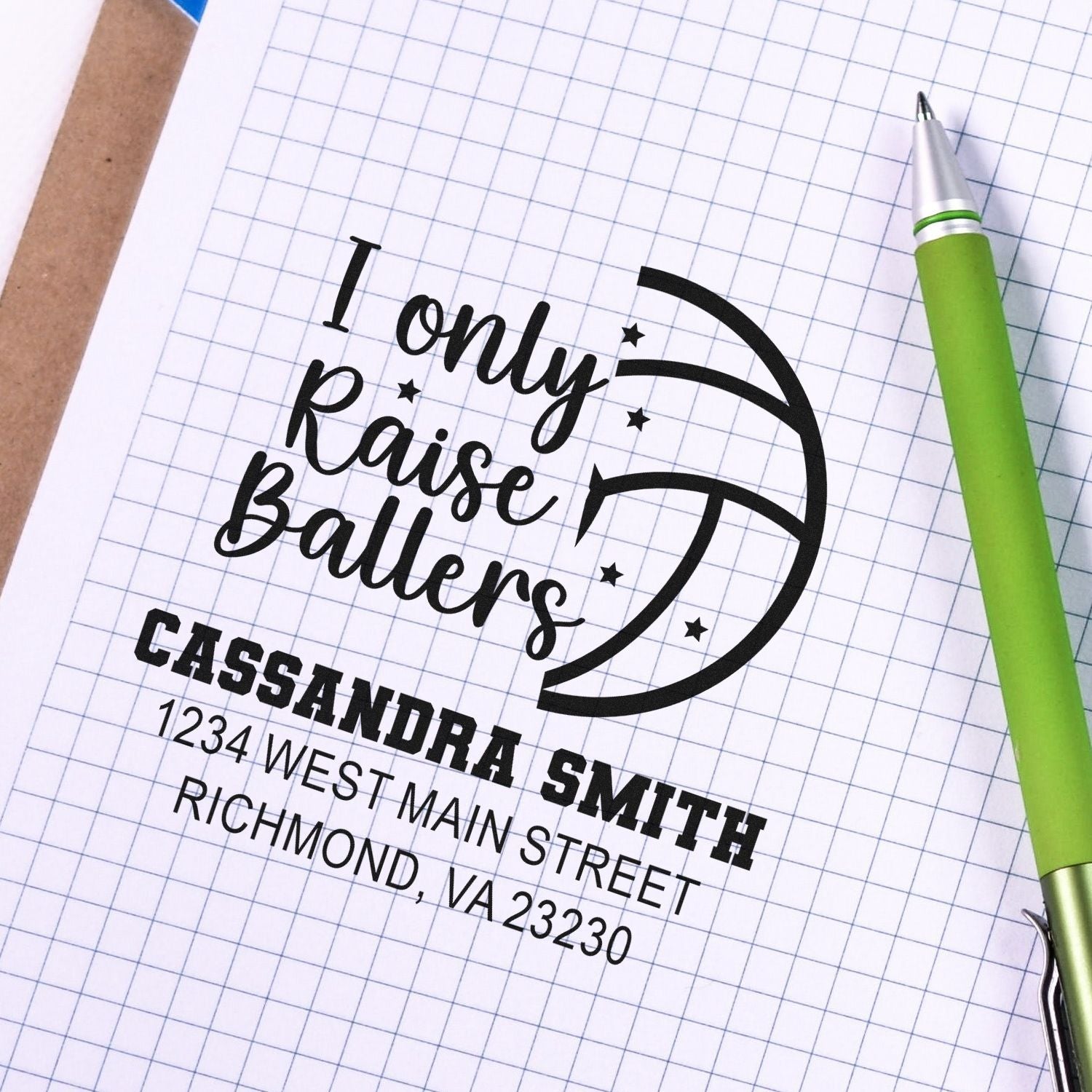 Custom rubber stamp design with I only raise ballers basketball logo, Cassandra Smith name, and address on graph paper.