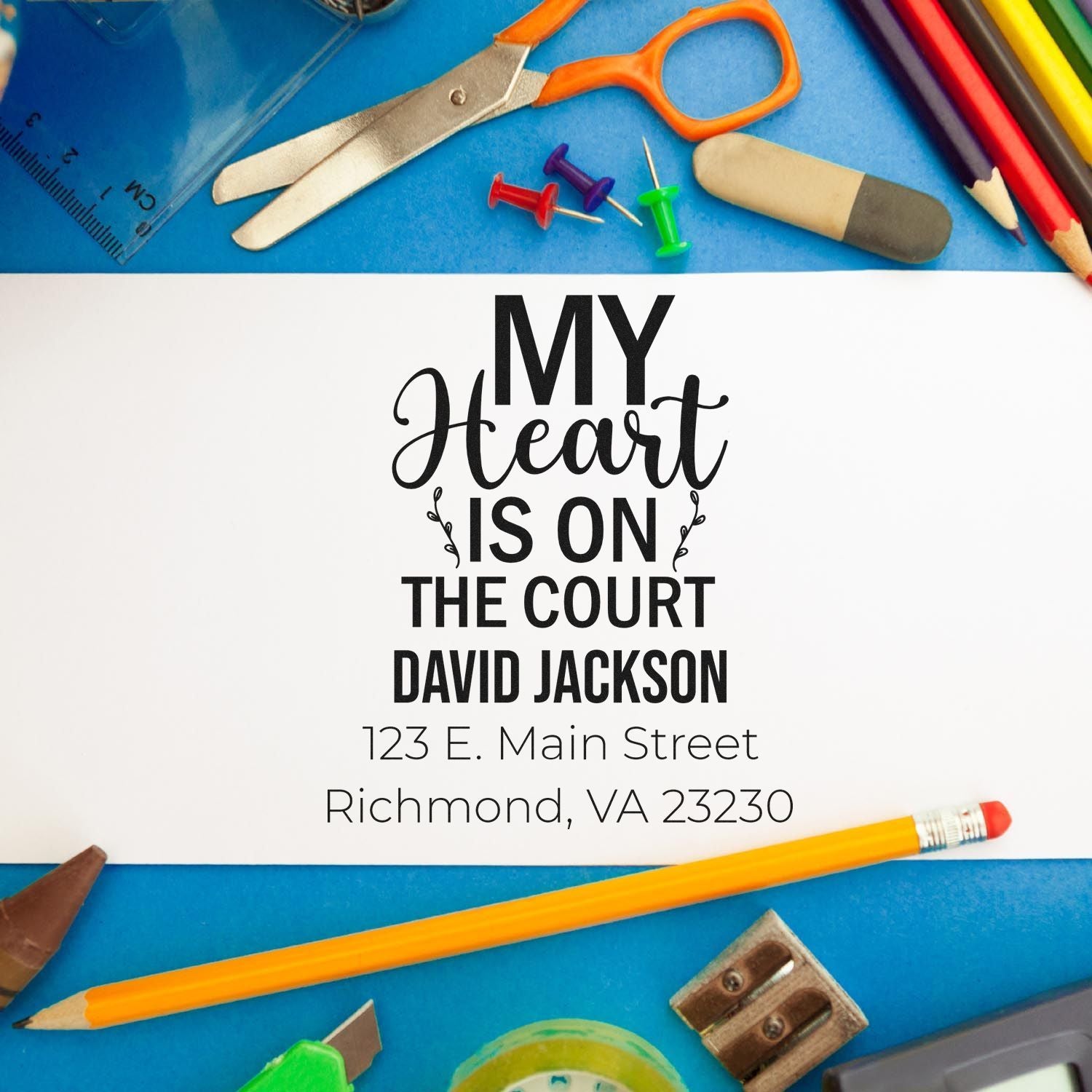 Basketball-themed custom rubber stamp design with name and address for personalized school or sports stationery.