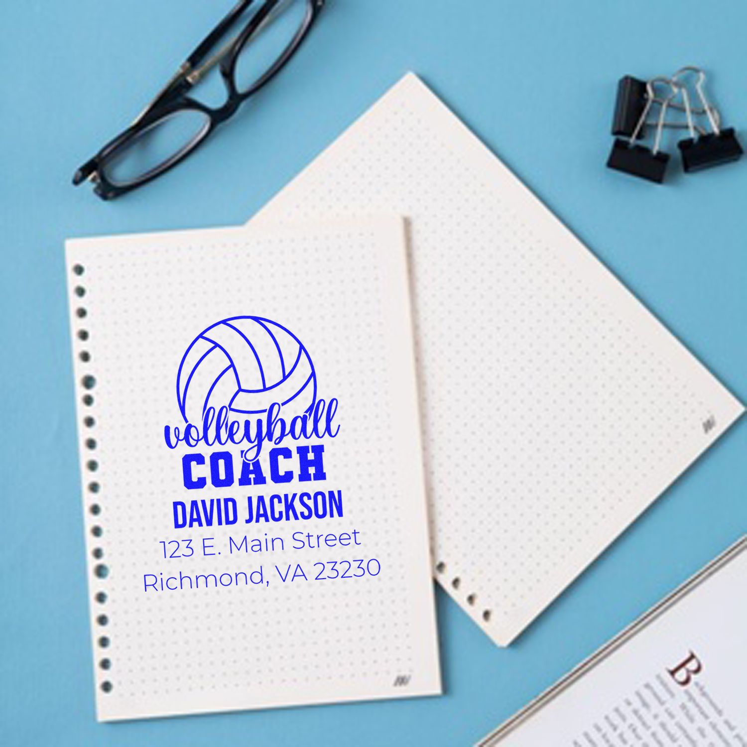 Personalized volleyball coach rubber stamp with name and address on notebook pages for custom sports stationery.