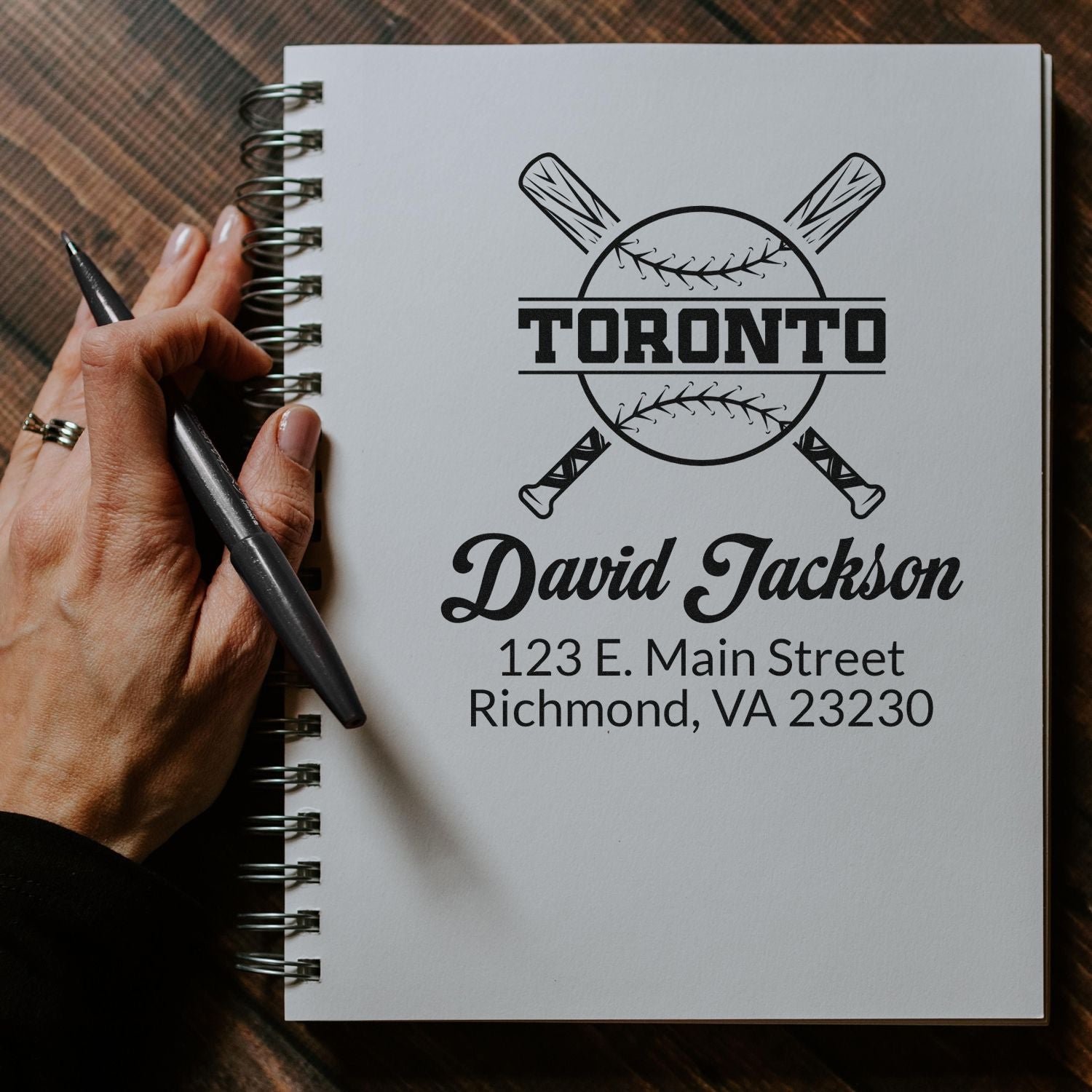 Custom baseball rubber stamp mockup with Toronto logo, name, and address for personalized sports branding.