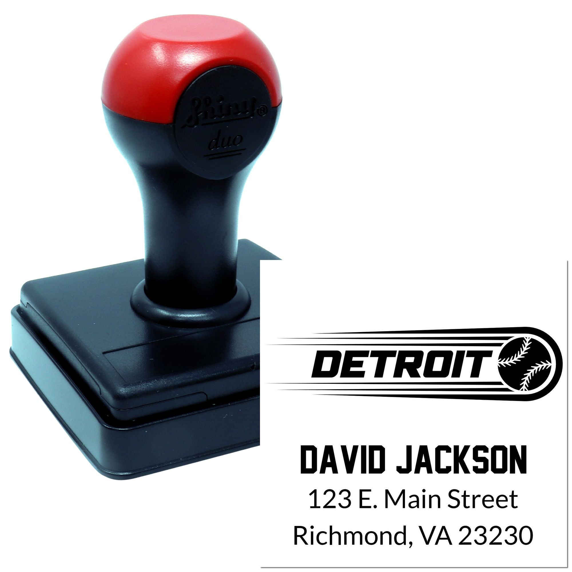 Custom self-inking rubber stamp with Detroit logo, name, and address for business branding and mailing.