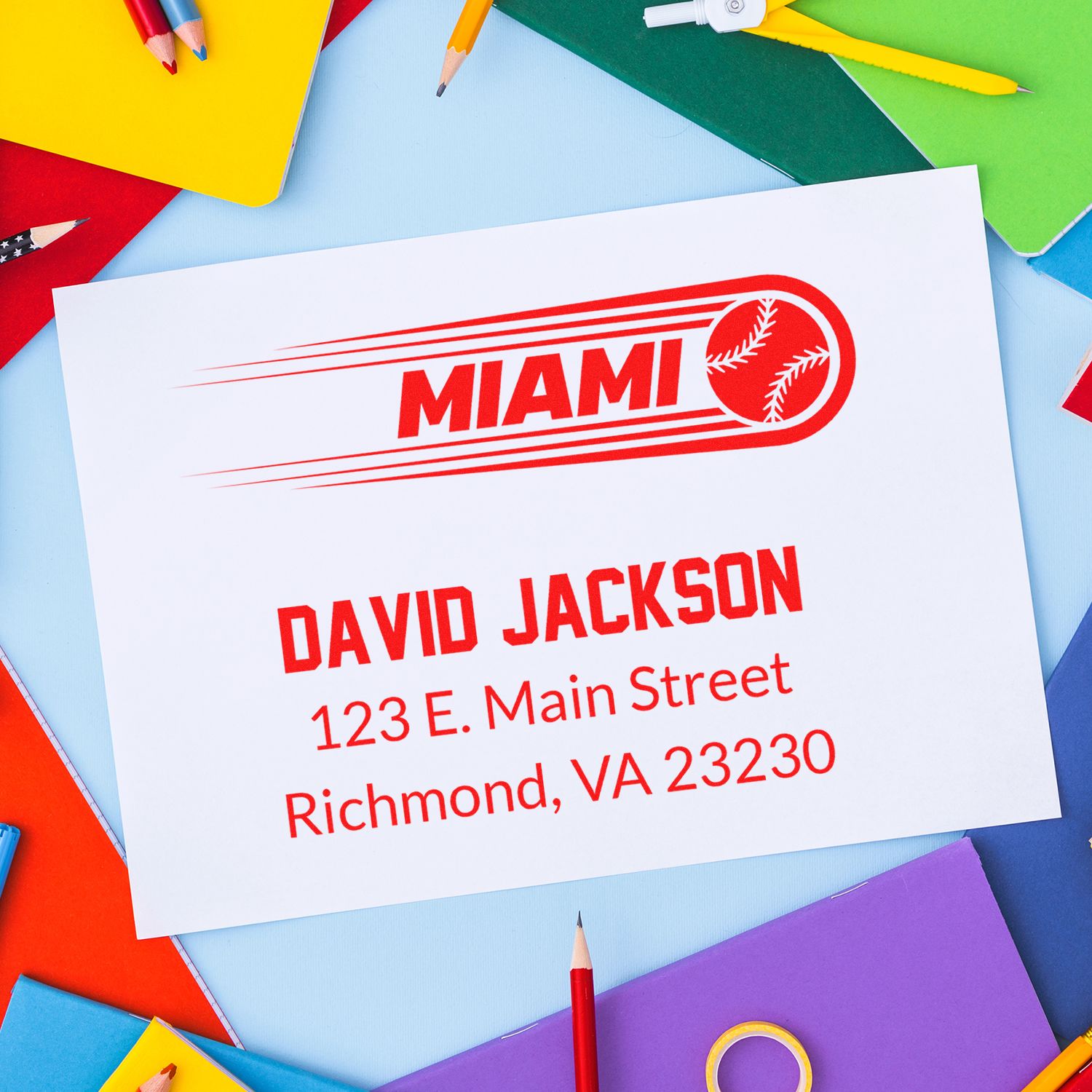 Custom rubber stamp with Miami baseball logo, name, and address for personalized business mailing and branding.