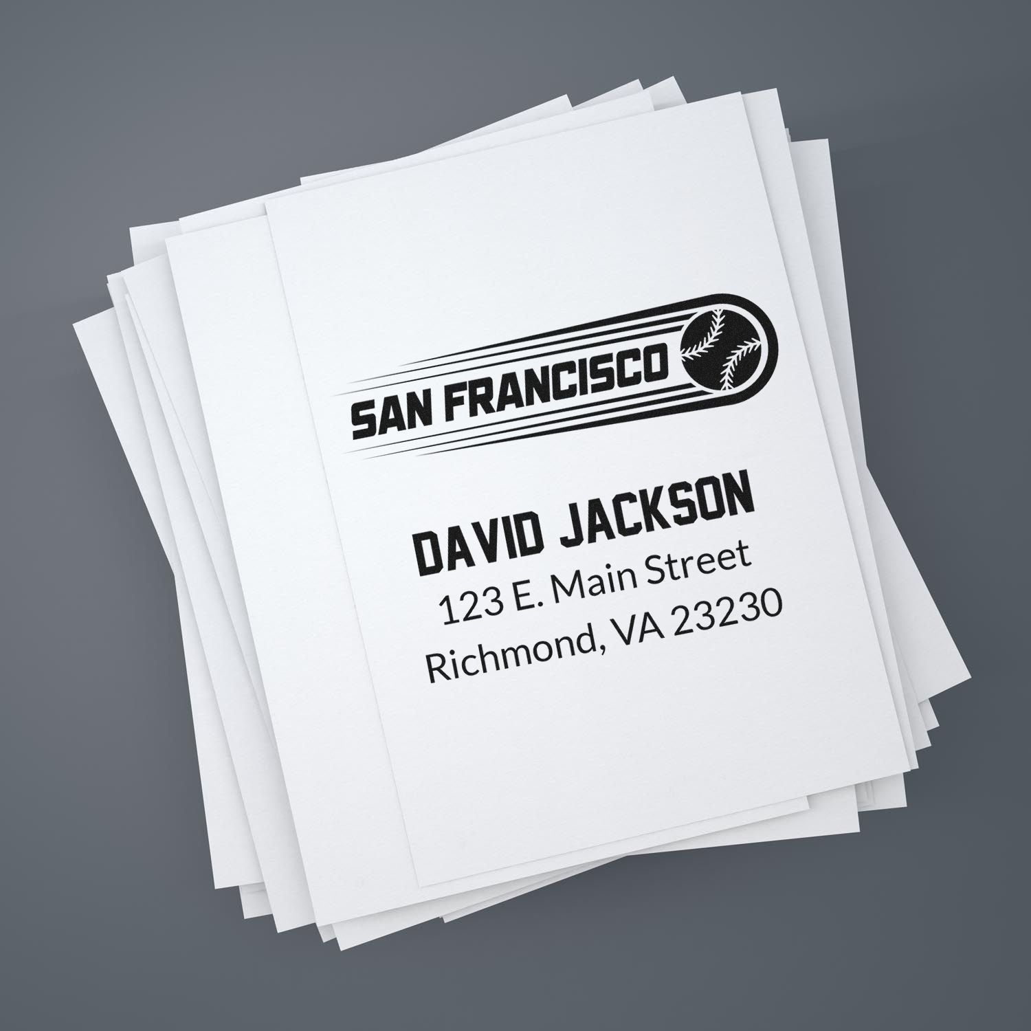 Custom rubber address stamp on paper stack with San Francisco baseball design and David Jackson return address.