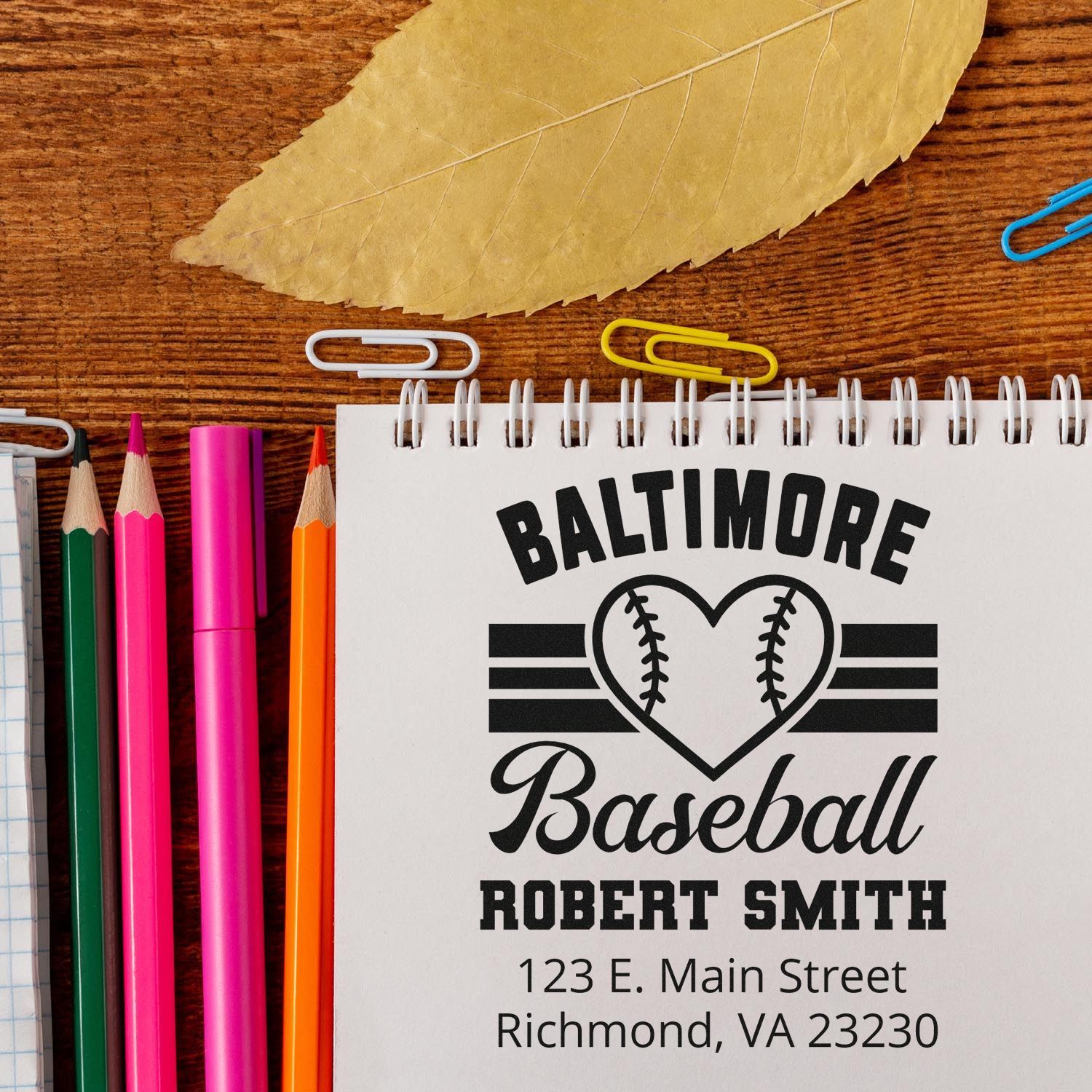 Personalized Baltimore Baseball rubber stamp design with Robert Smith name and address on a notebook.