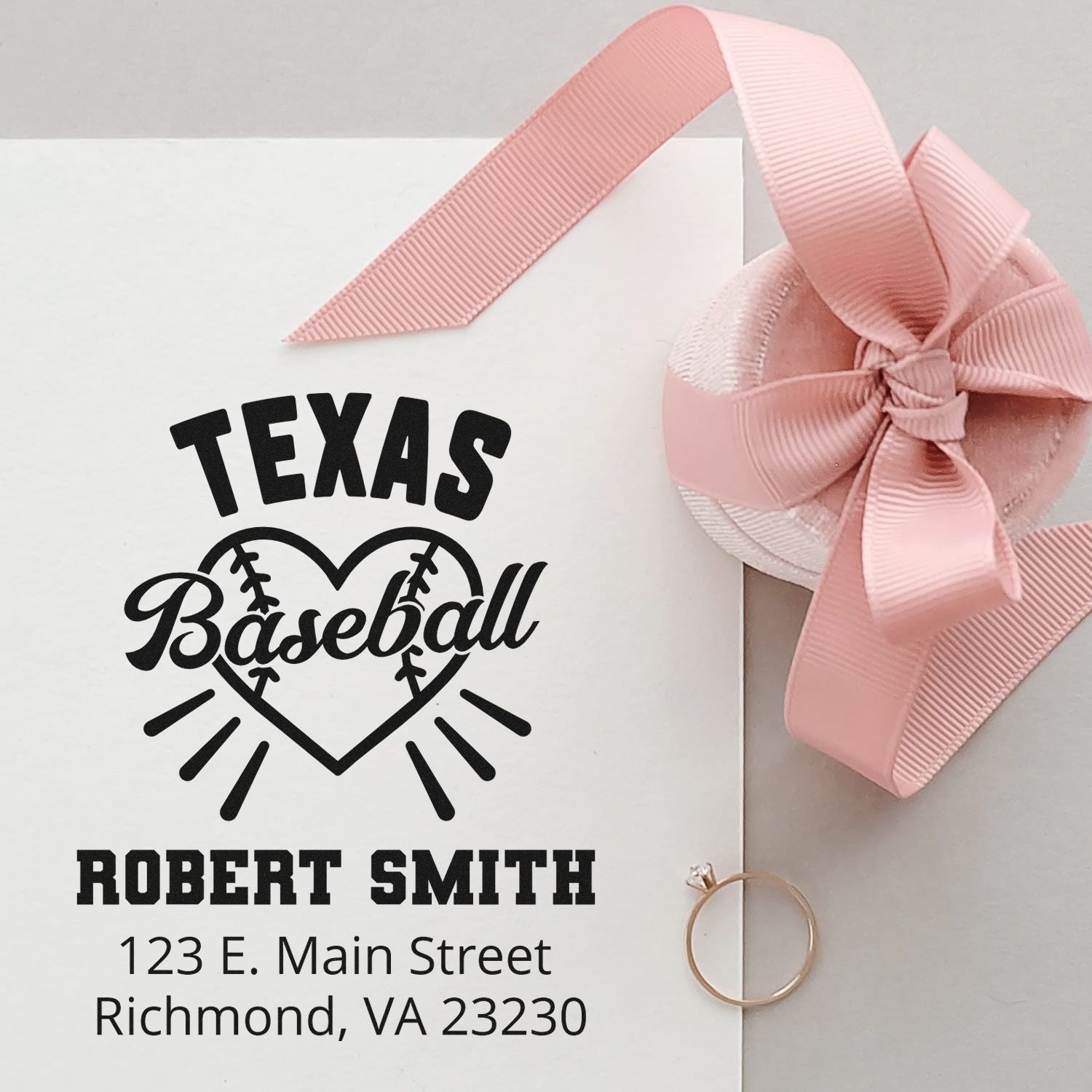 Custom Texas Baseball rubber stamp with name and address on gift package, accented with pink ribbon.