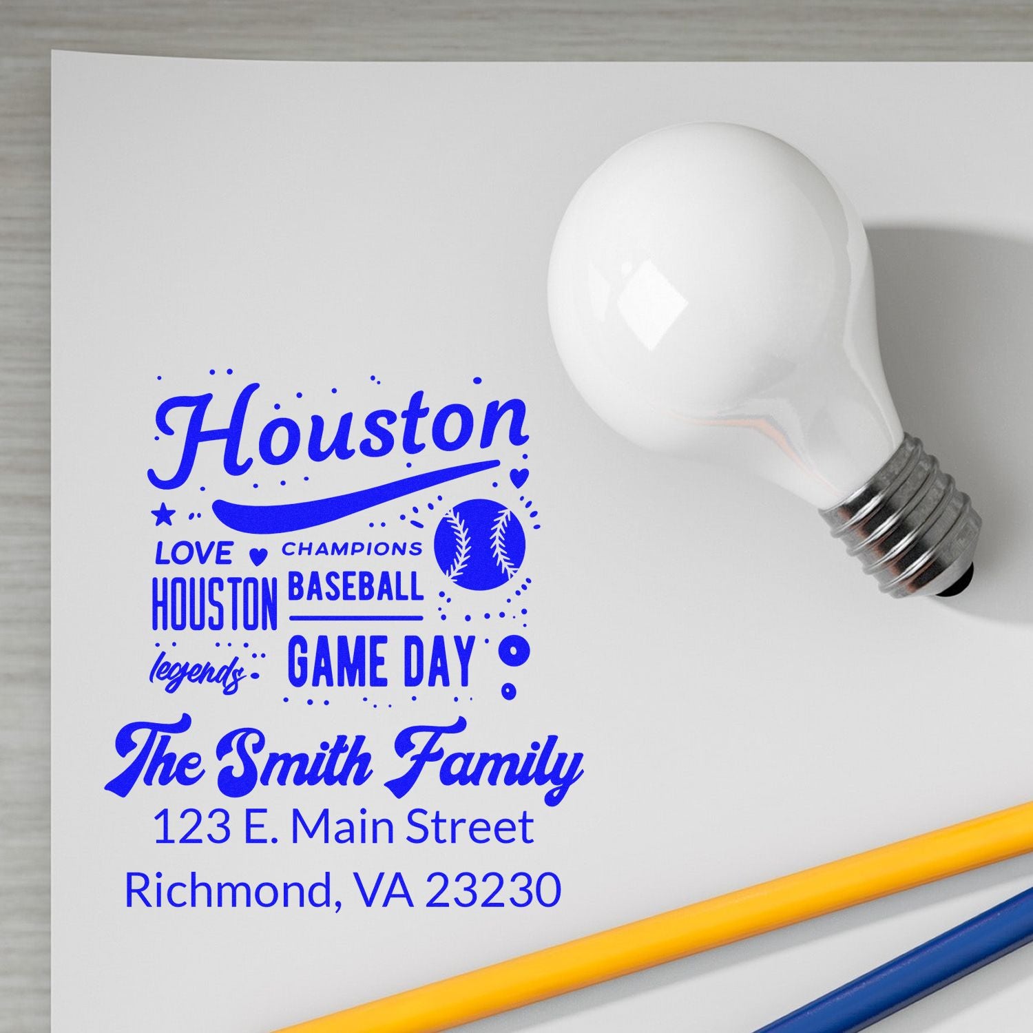 Custom rubber stamp design proof with Houston baseball theme, The Smith Family return address, and Game Day text in blue.
