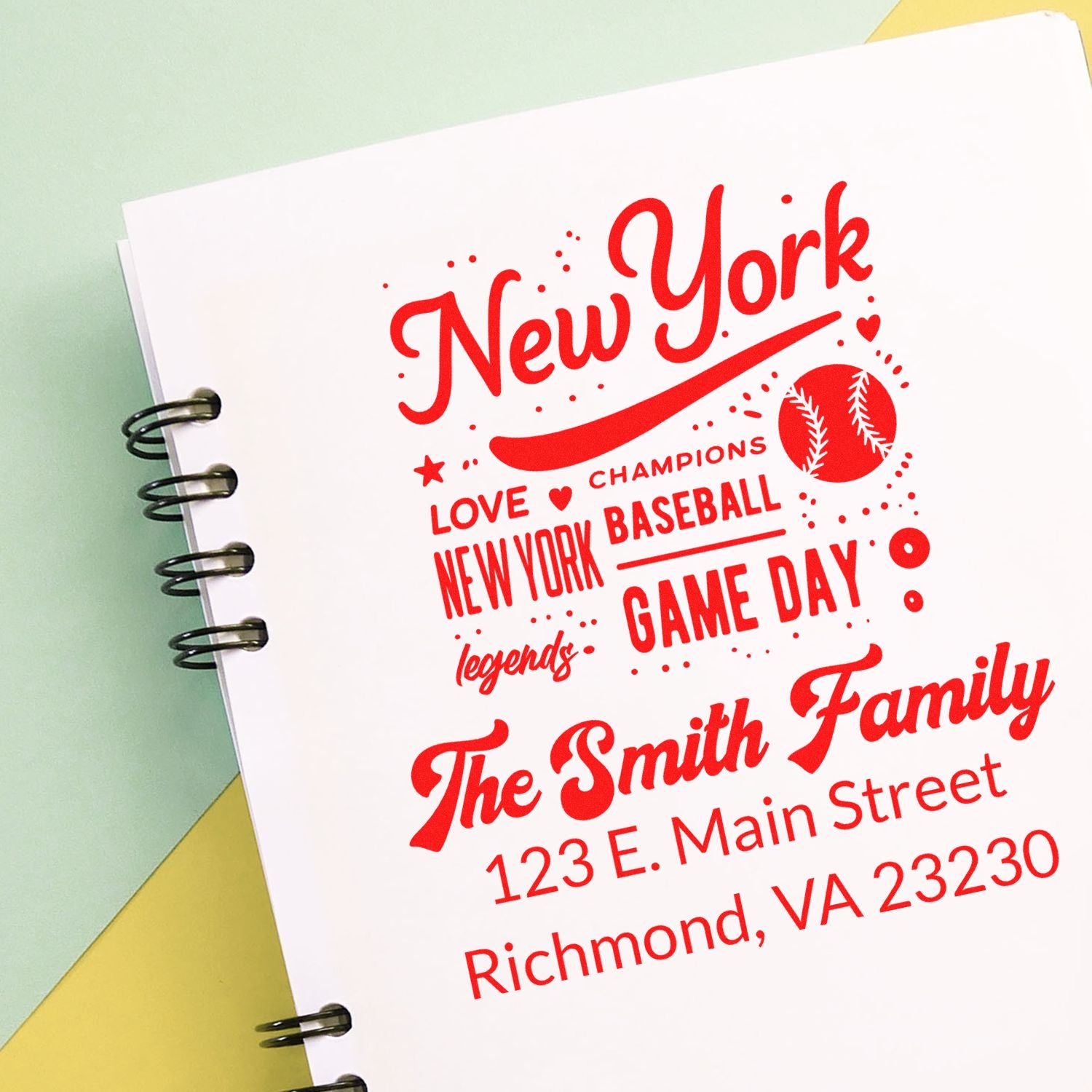 Custom New York baseball rubber stamp impression with family name and address on notebook stationery.