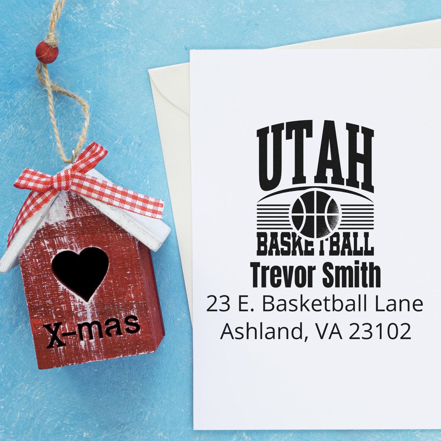Personalized basketball return address rubber stamp with Trevor Smith name and address, shown on a holiday card.