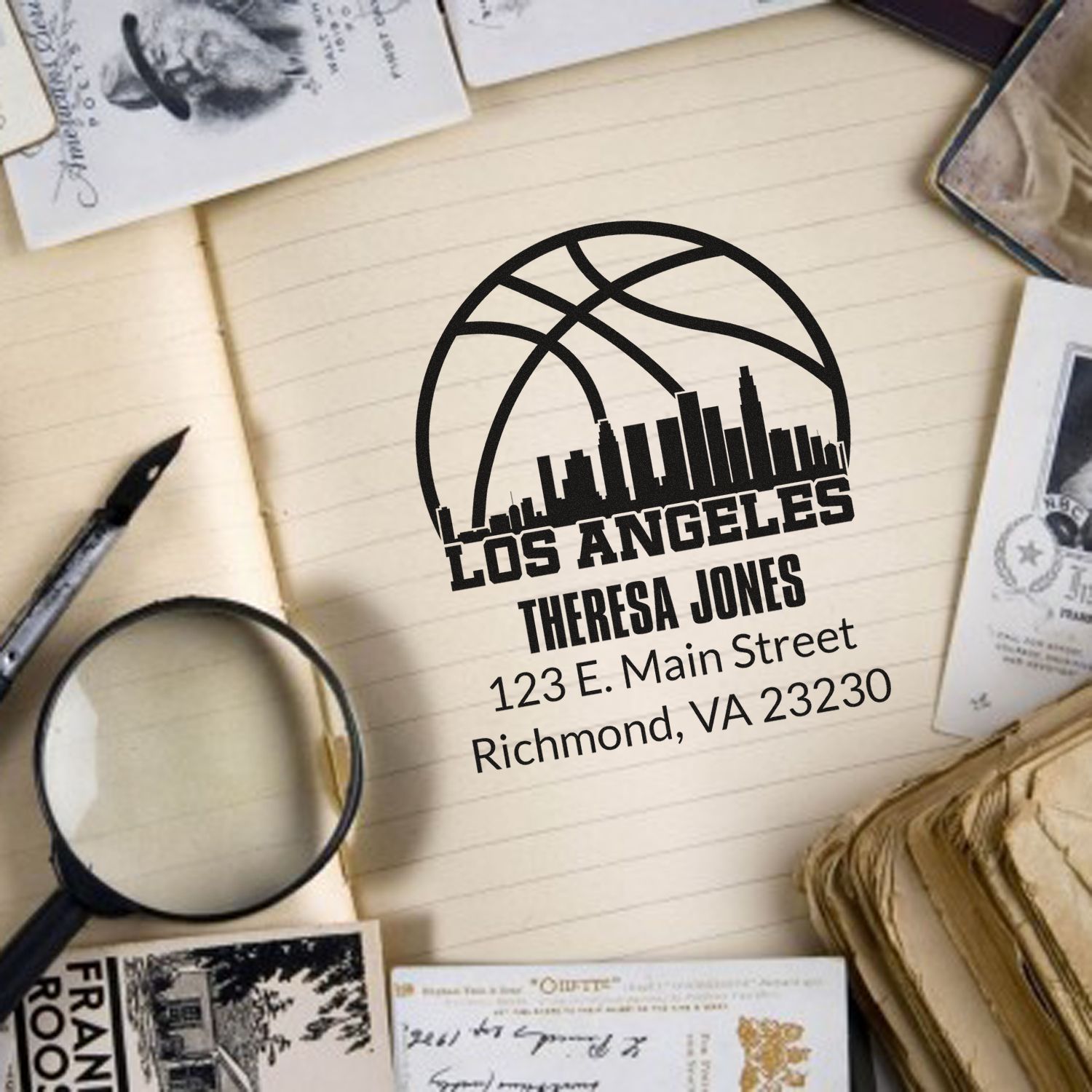 Custom address rubber stamp with basketball skyline logo, personalized name, and return address for stationery or business use.