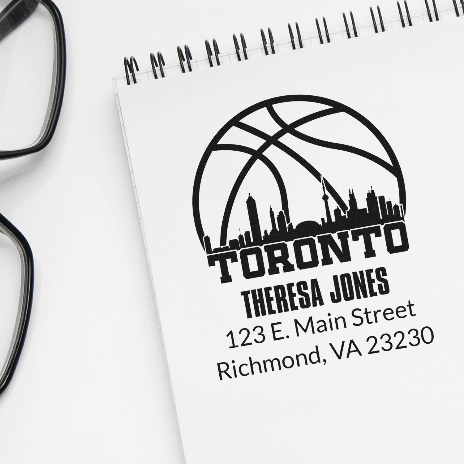 Custom Toronto basketball return address rubber stamp for Theresa Jones, 123 E. Main Street, Richmond, VA 23230.