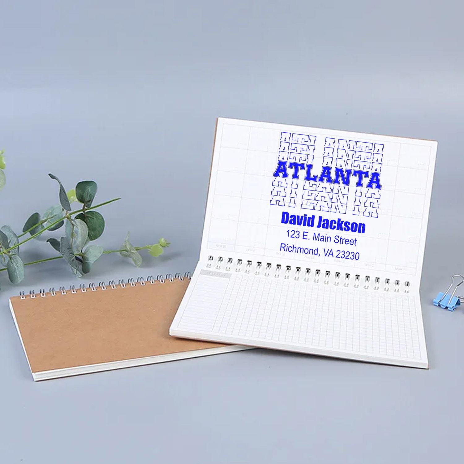 Custom Atlanta address rubber stamp for David Jackson, showing a personalized business imprint on notebook pages.