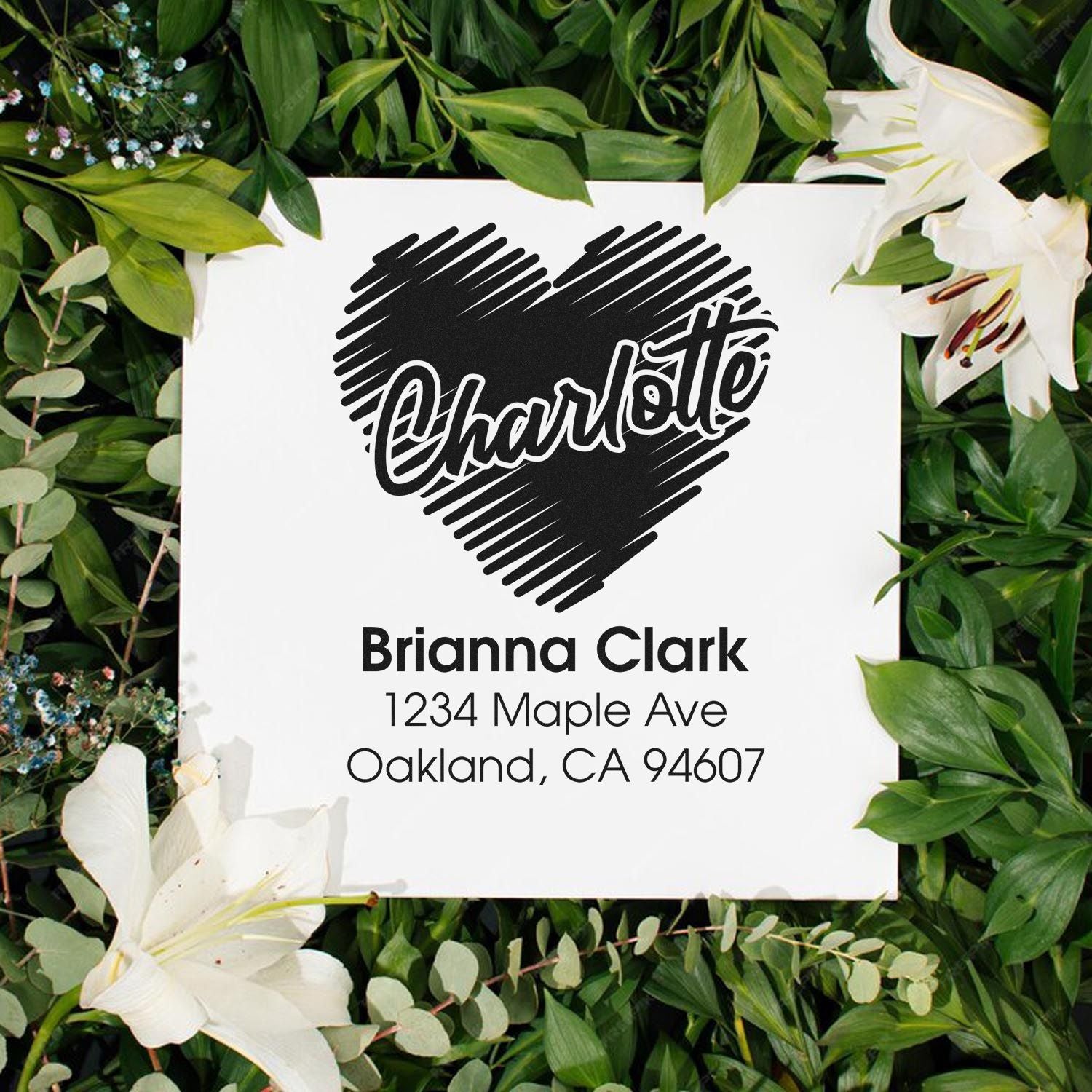 Personalized return address rubber stamp with heart design for Brianna Clark, Oakland, CA mailing labels.