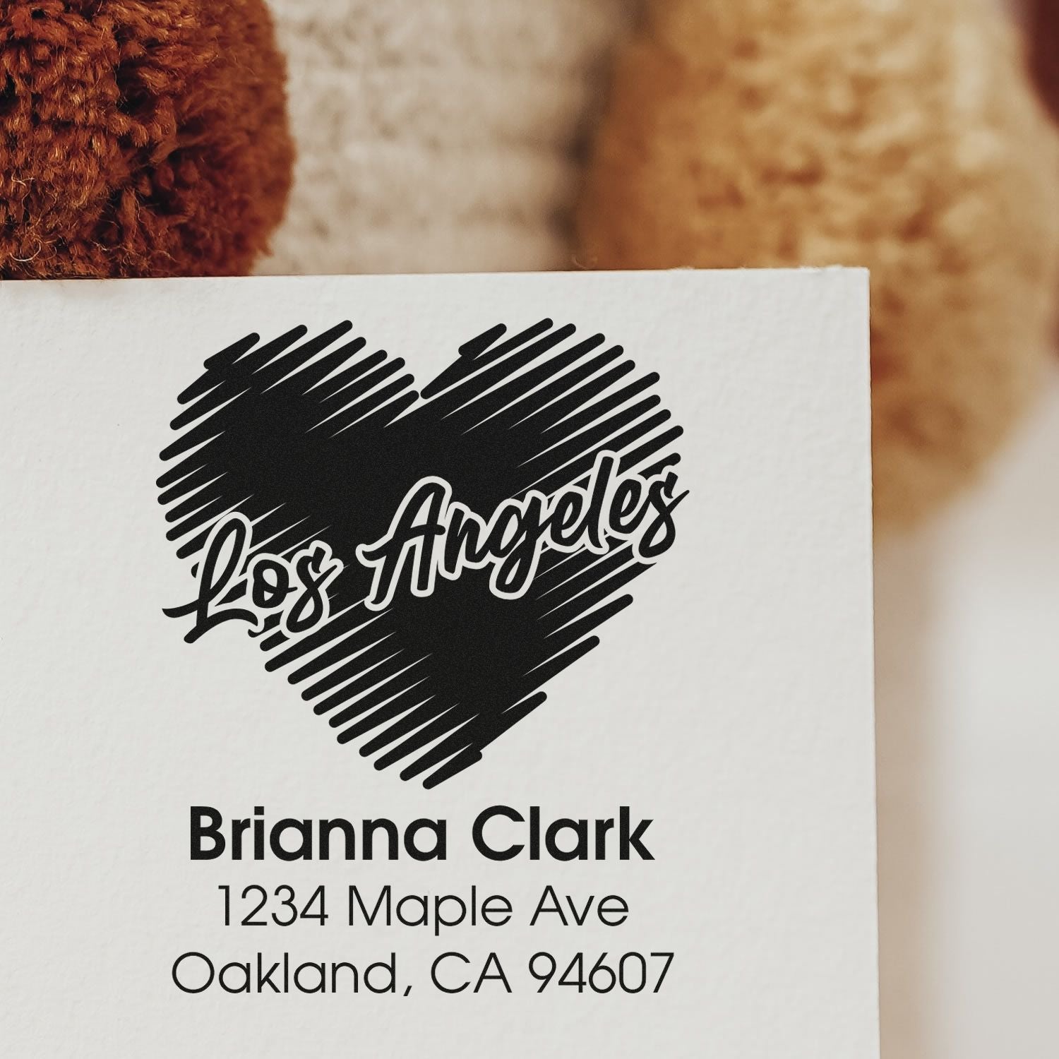 Custom return address rubber stamp with Los Angeles heart logo for Brianna Clark, Oakland, CA 94607