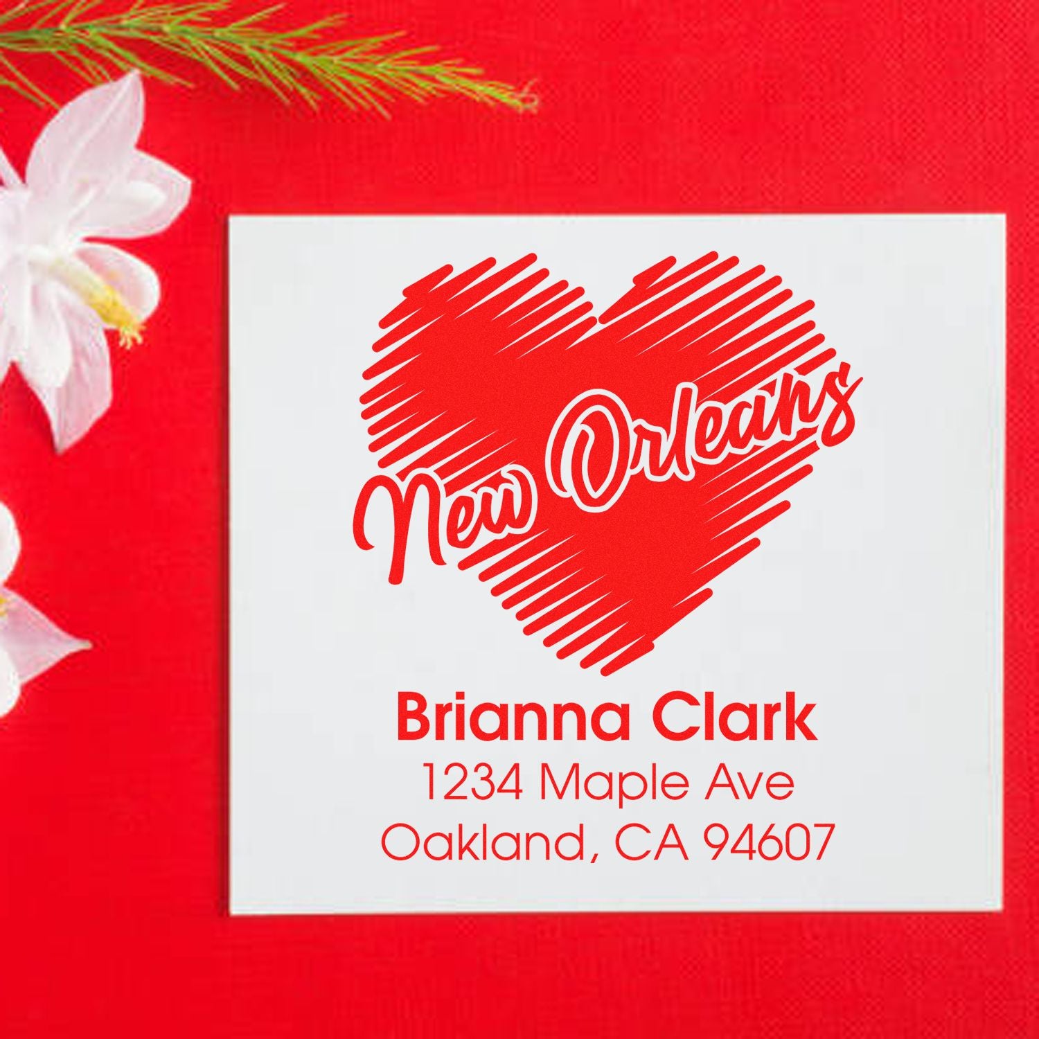 Custom New Orleans rubber stamp with heart design and return address for Brianna Clark, Oakland, CA 94607.