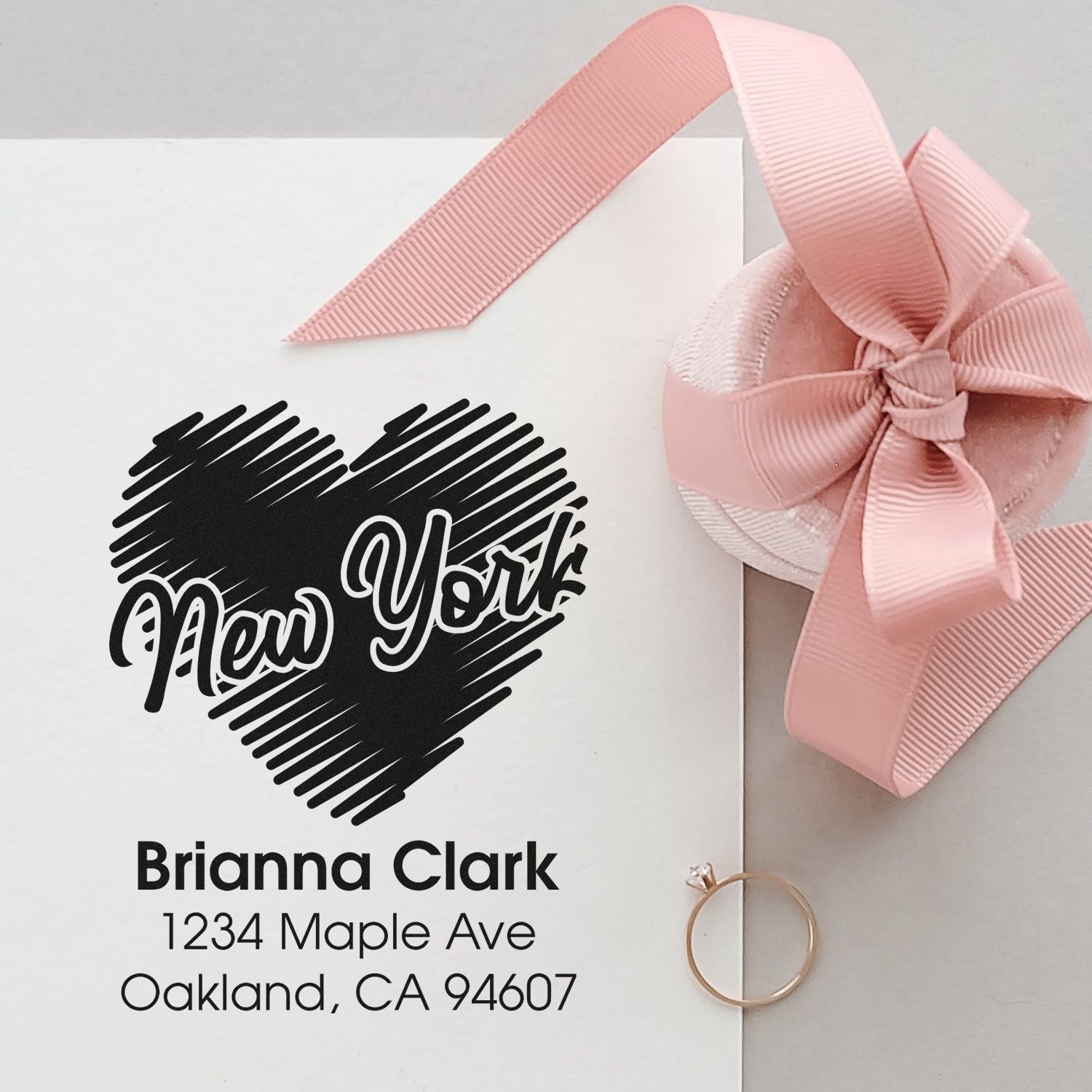 Personalized return address rubber stamp with heart and New York design for Brianna Clark stationery and wedding favors.