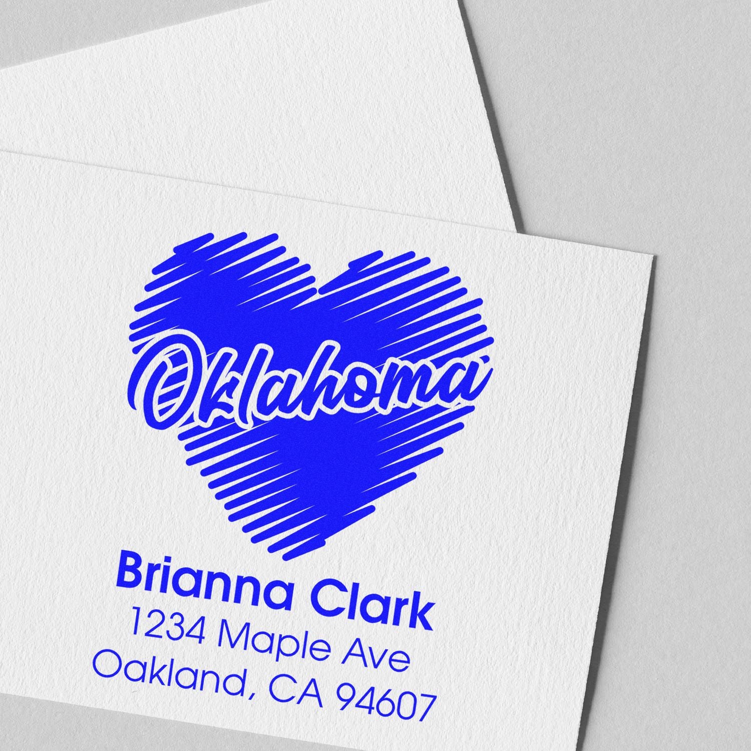 Custom Oklahoma heart return address rubber stamp with Brianna Clark name and address on white cardstock.
