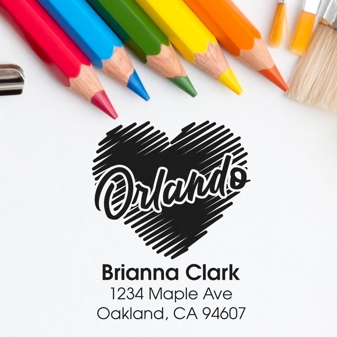 Custom address rubber stamp with heart logo and Brianna Clark mailing address for personalized envelopes.