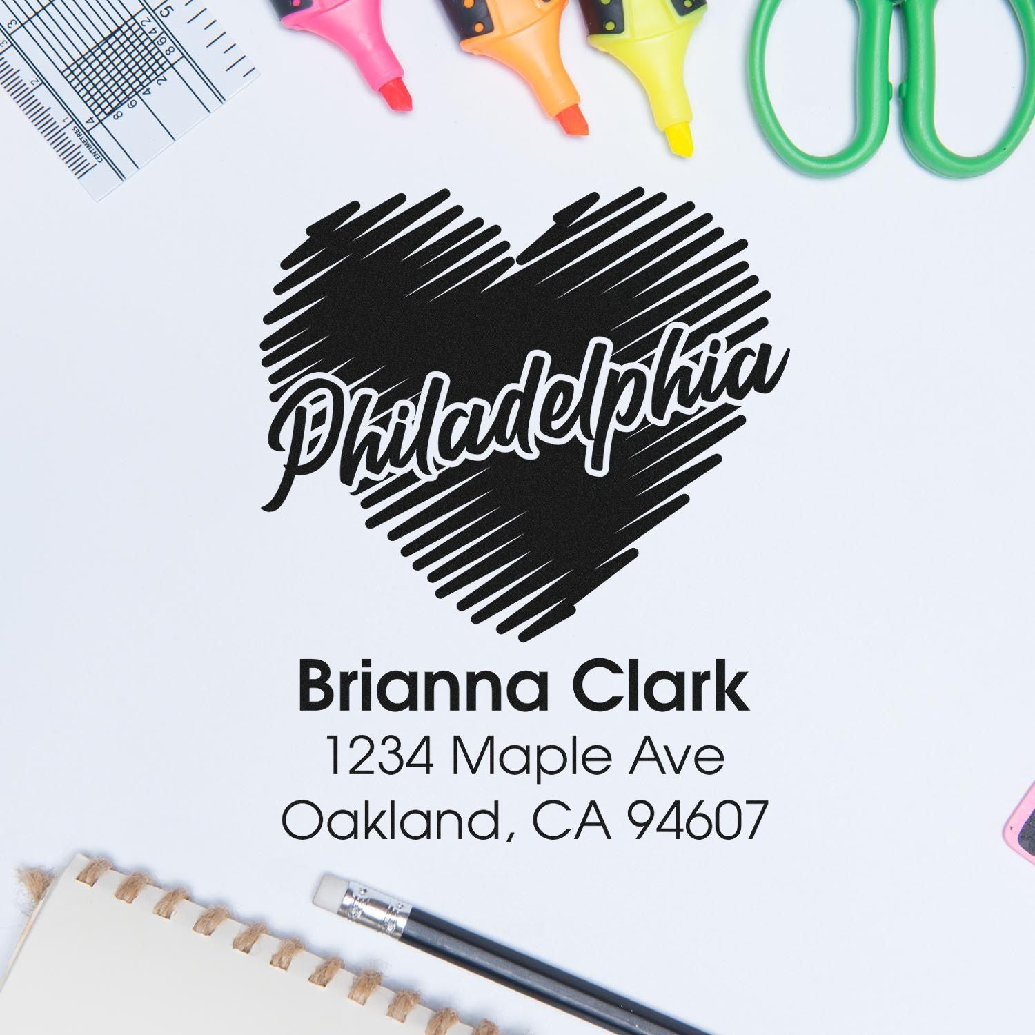 Custom Philadelphia heart return address rubber stamp with Brianna Clark name and Oakland, CA address for mailing.