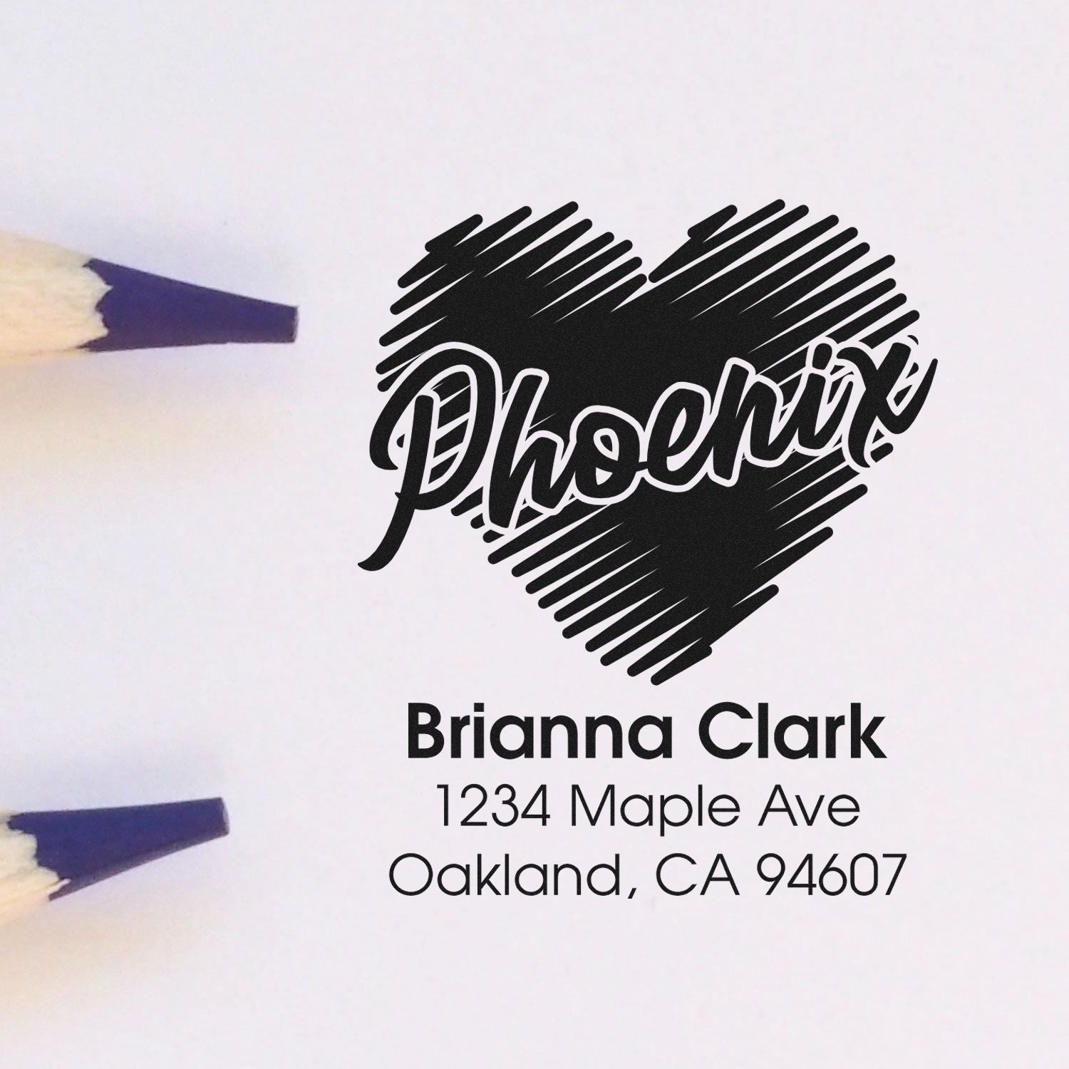Custom rubber return address stamp proof with heart logo, Brianna Clark, 1234 Maple Ave, Oakland, CA 94607.