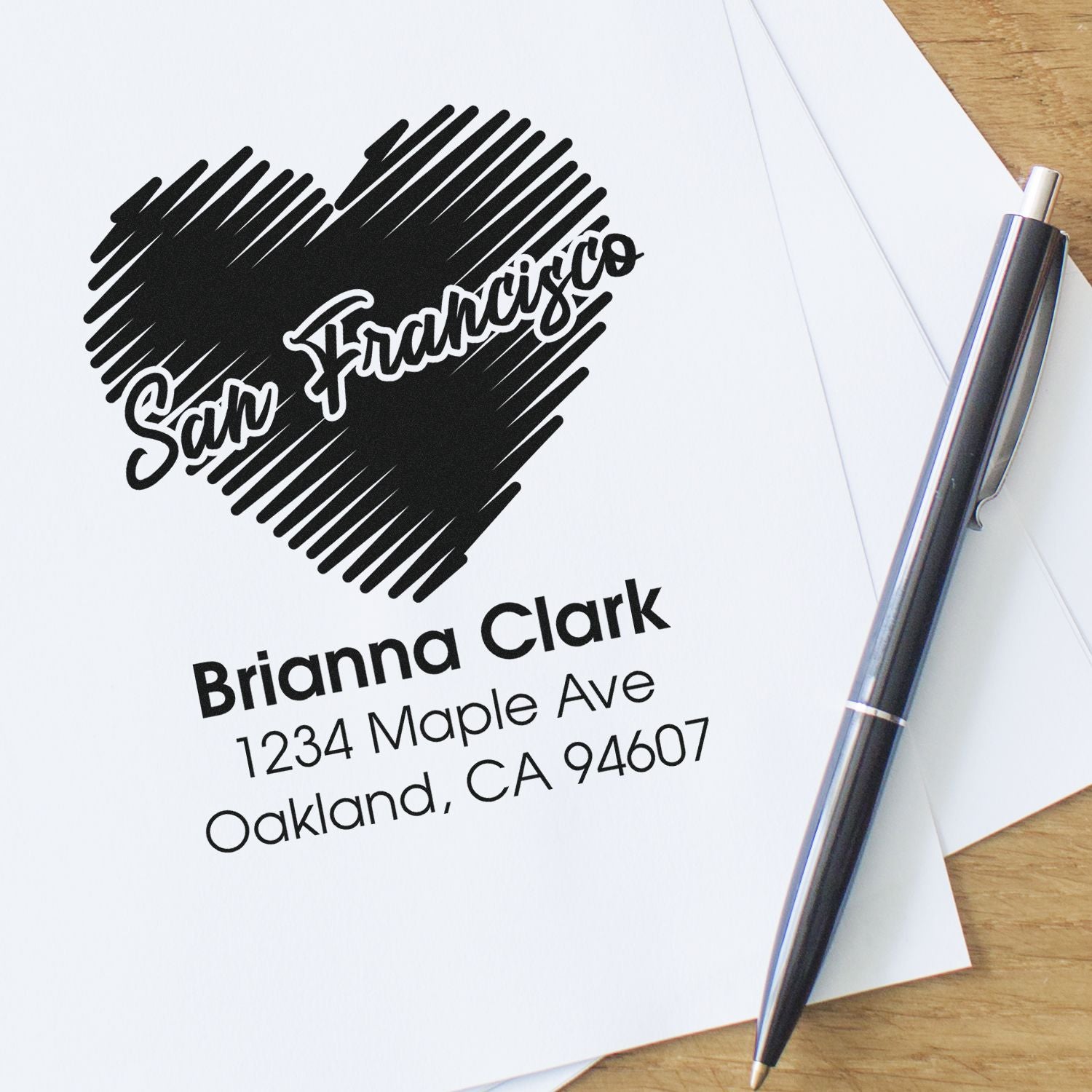 Custom San Francisco return address rubber stamp with heart design, name and mailing address.