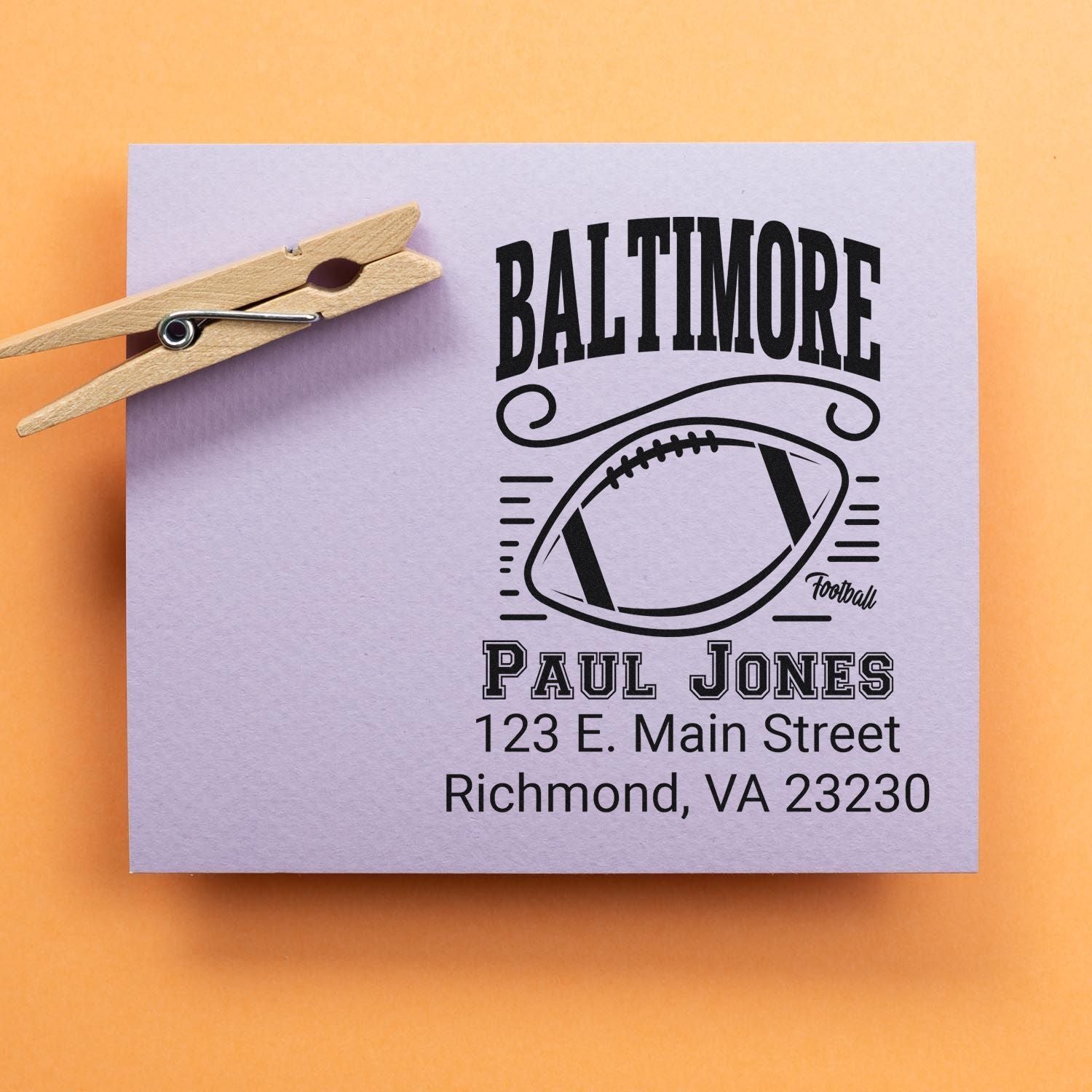 Custom football address rubber stamp with Baltimore design, Paul Jones name, and Richmond, VA address for personalized mailings.
