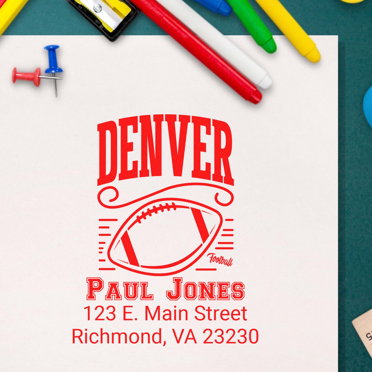 Custom football rubber stamp mockup with Denver, Paul Jones, and Richmond, VA address for branding stationery.