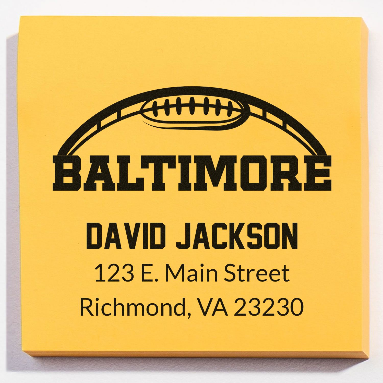 Custom Baltimore address rubber stamp for David Jackson with football logo and return mailing details.
