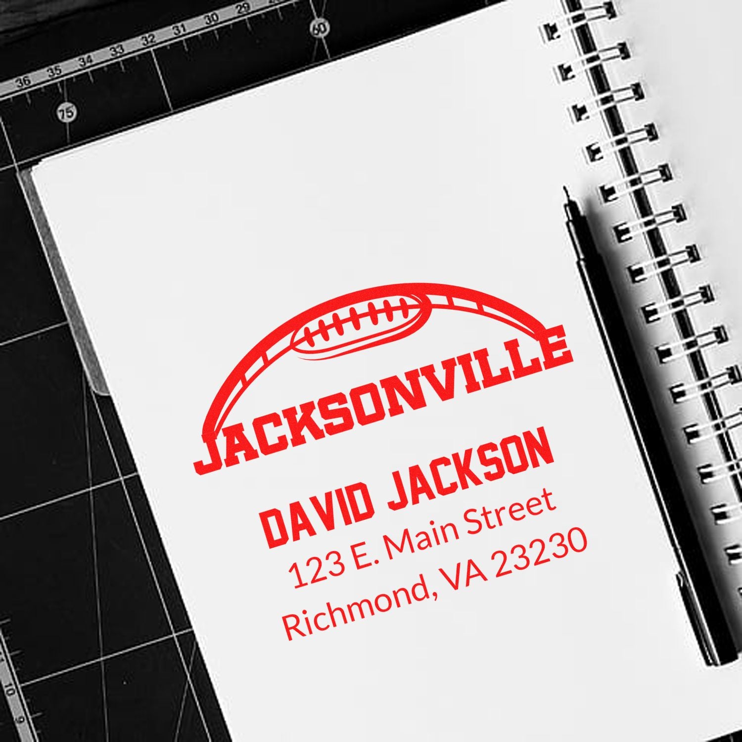 Custom football rubber address stamp for David Jackson, featuring name, street address, and Richmond, VA 23230.