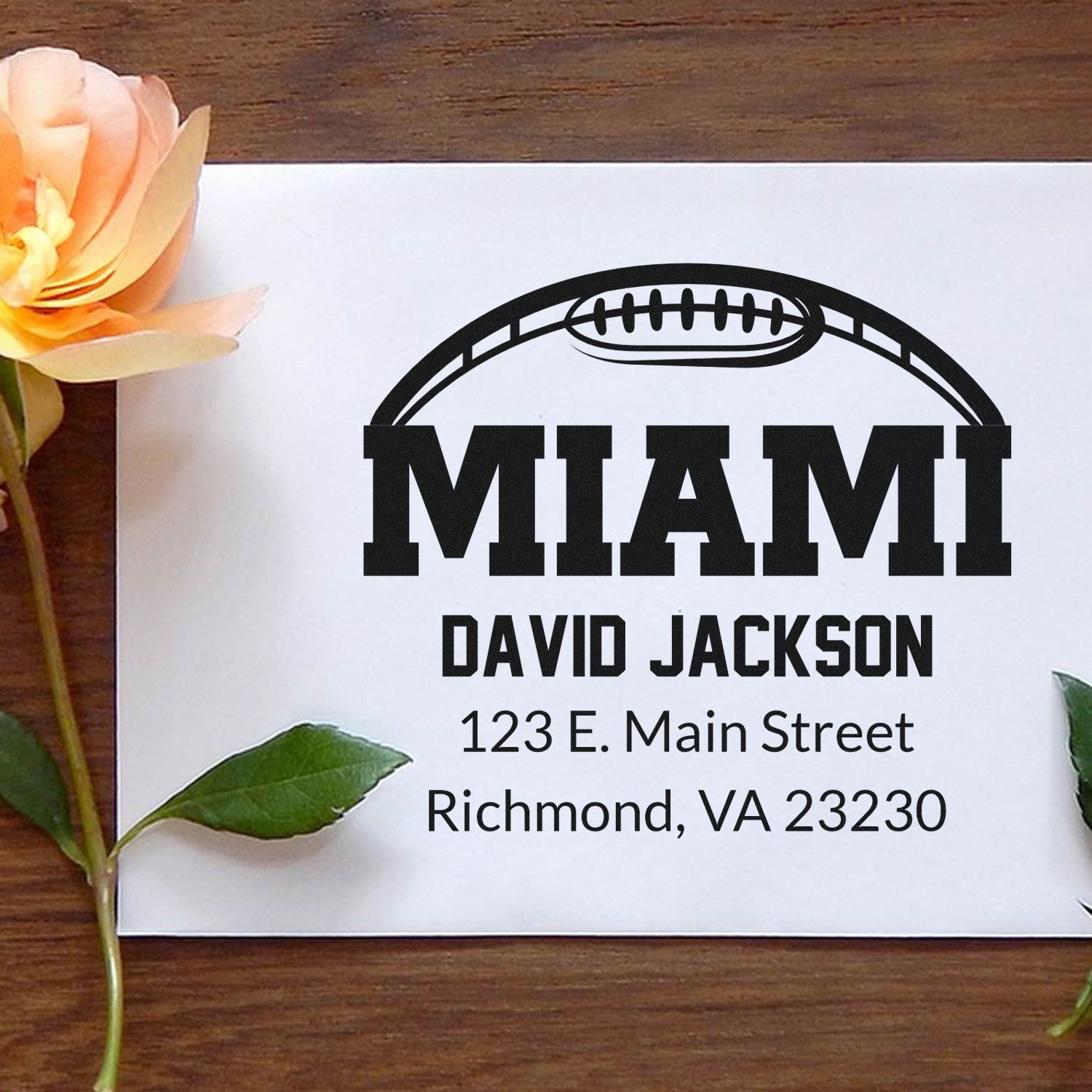 Custom Miami football return address rubber stamp with name and street address for personalized envelopes.