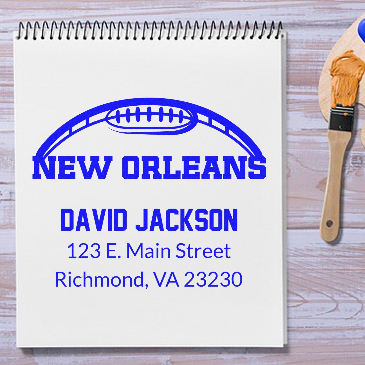 Custom New Orleans address rubber stamp for David Jackson with football logo, ideal for personalized return mail.