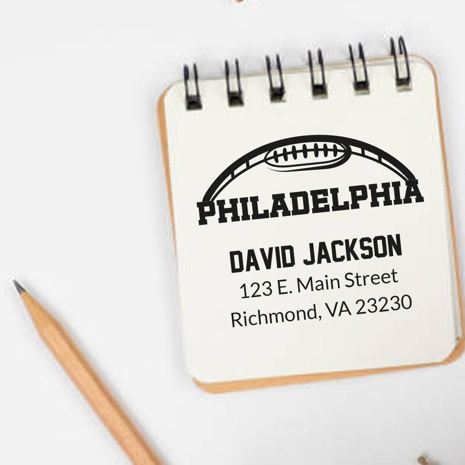 Custom Philadelphia football rubber stamp with name and address for personalized sports stationery and gifts.